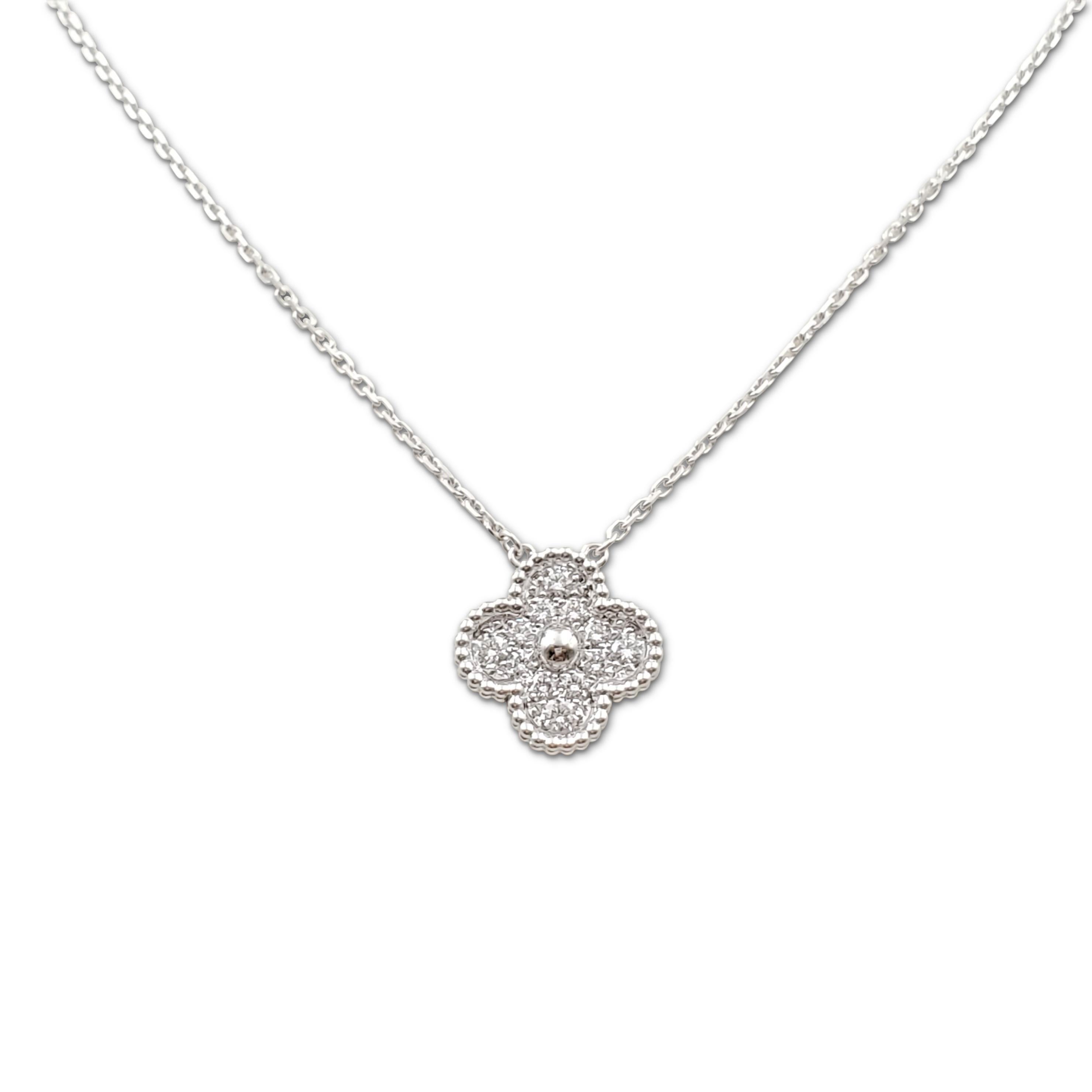Authentic Van Cleef & Arpels 'Vintage Alhambra' pendant necklace crafted in 18 karat white gold features a single clover-inspired motif set with an estimated 0.48 carats of round brilliant cut diamonds (E color, VS clarity). Signed VCA, Au750, with