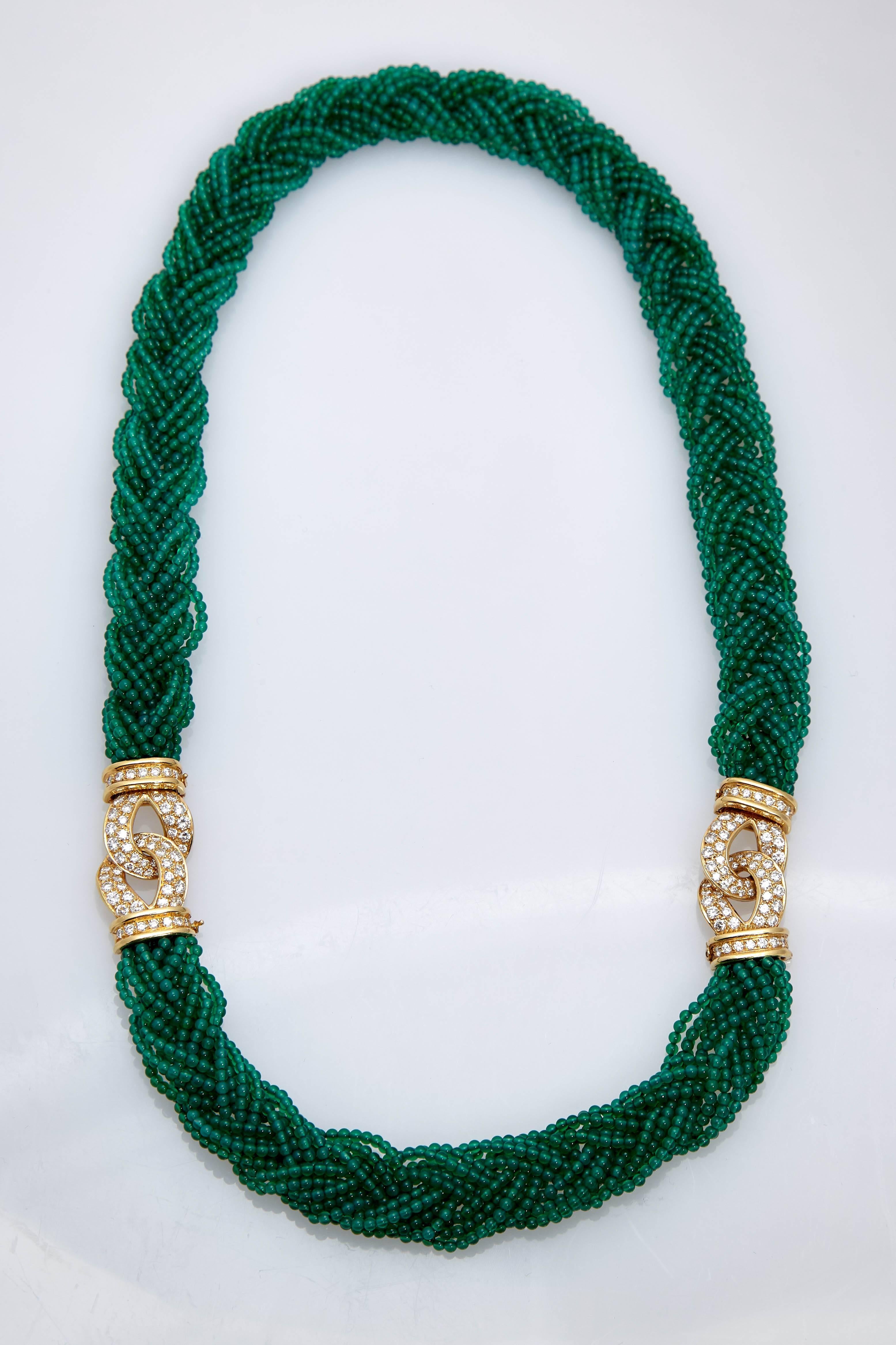 A beautiful torchon necklace by Van Cleef & Arpels with chrysoprase beads, clasped together by two marine not 18kt gold and diamond elements. Made in France, circa 1980