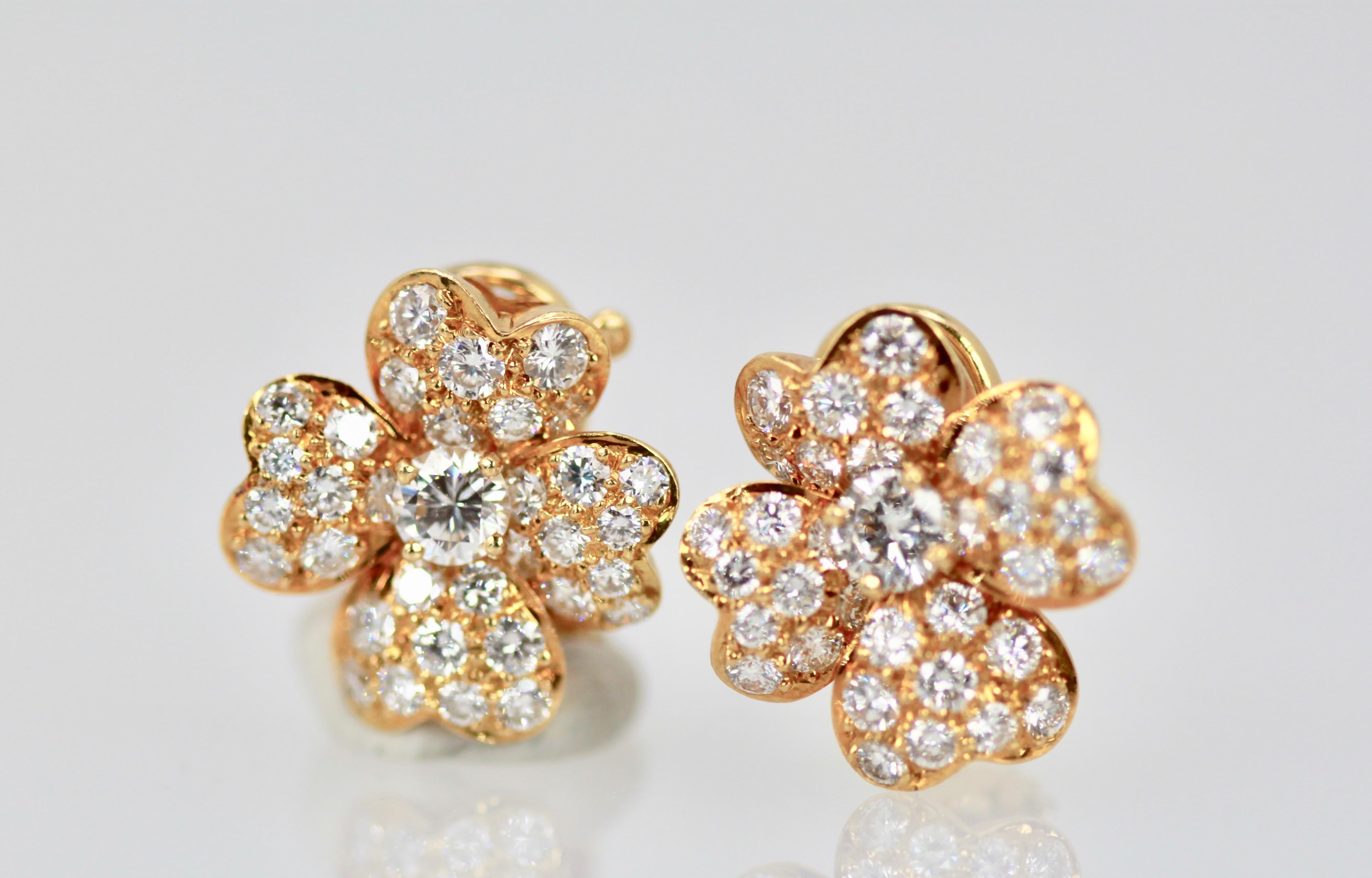 These Van Cleef Cosmos Diamond Earrings are the small model and they are non-pierced.  If you want to add a post that can be done very easily to turn them into pierced earrings.  These are clips and hold 68 Round Diamonds approximately 1 carat F