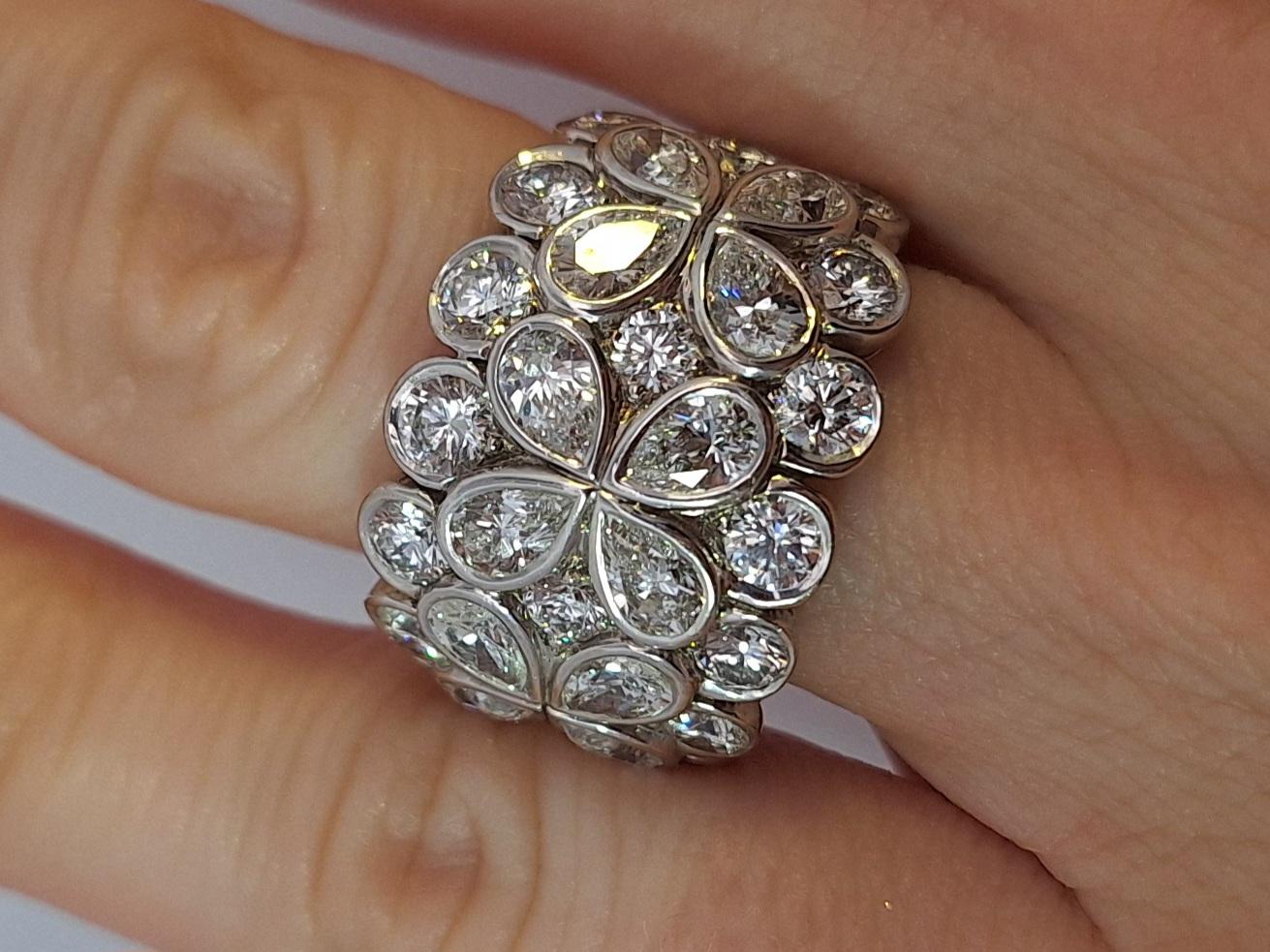 The ring is 18K White Gold. There are 4.25ct in Diamonds F VVS. The ring has French Maker Marks on the outside of the ring. The ring comes with Certificate of Authenticity. The ring is a size 6.5, can be sized sizable. The ring weighs 12.3 grams.