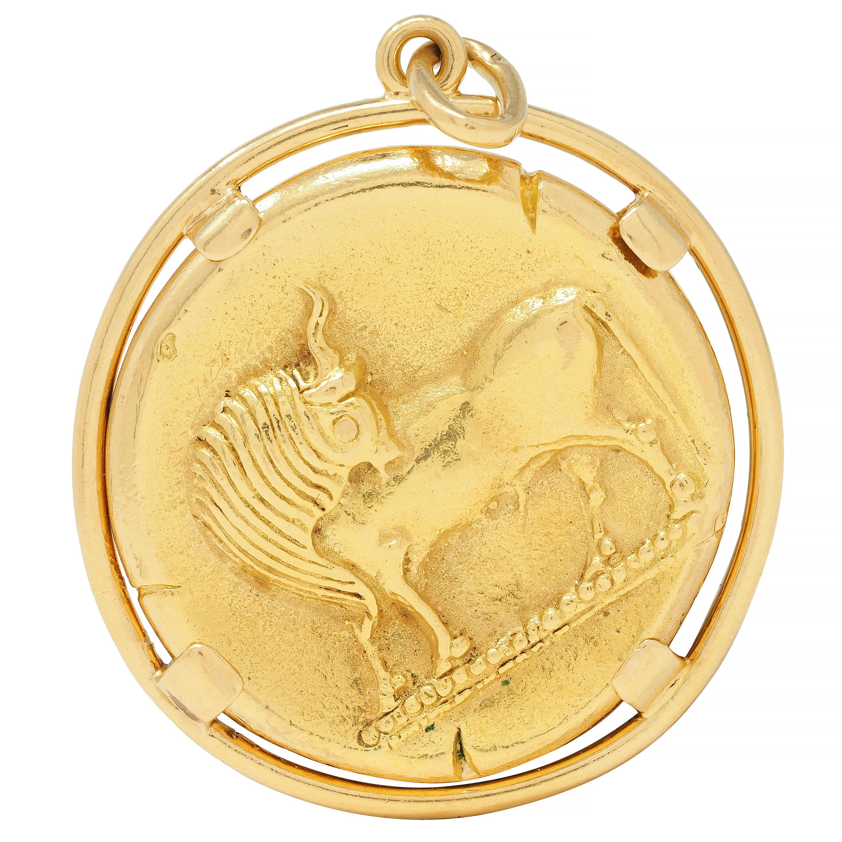Designed as a stylized Taurus figure with detailed features
Verso depicting the Taurus astrological sign
Centered in a pierced round frame surround
Suspending from jump ring bale
Stamped with French assay marks for 18 karat gold
Numbered and fully