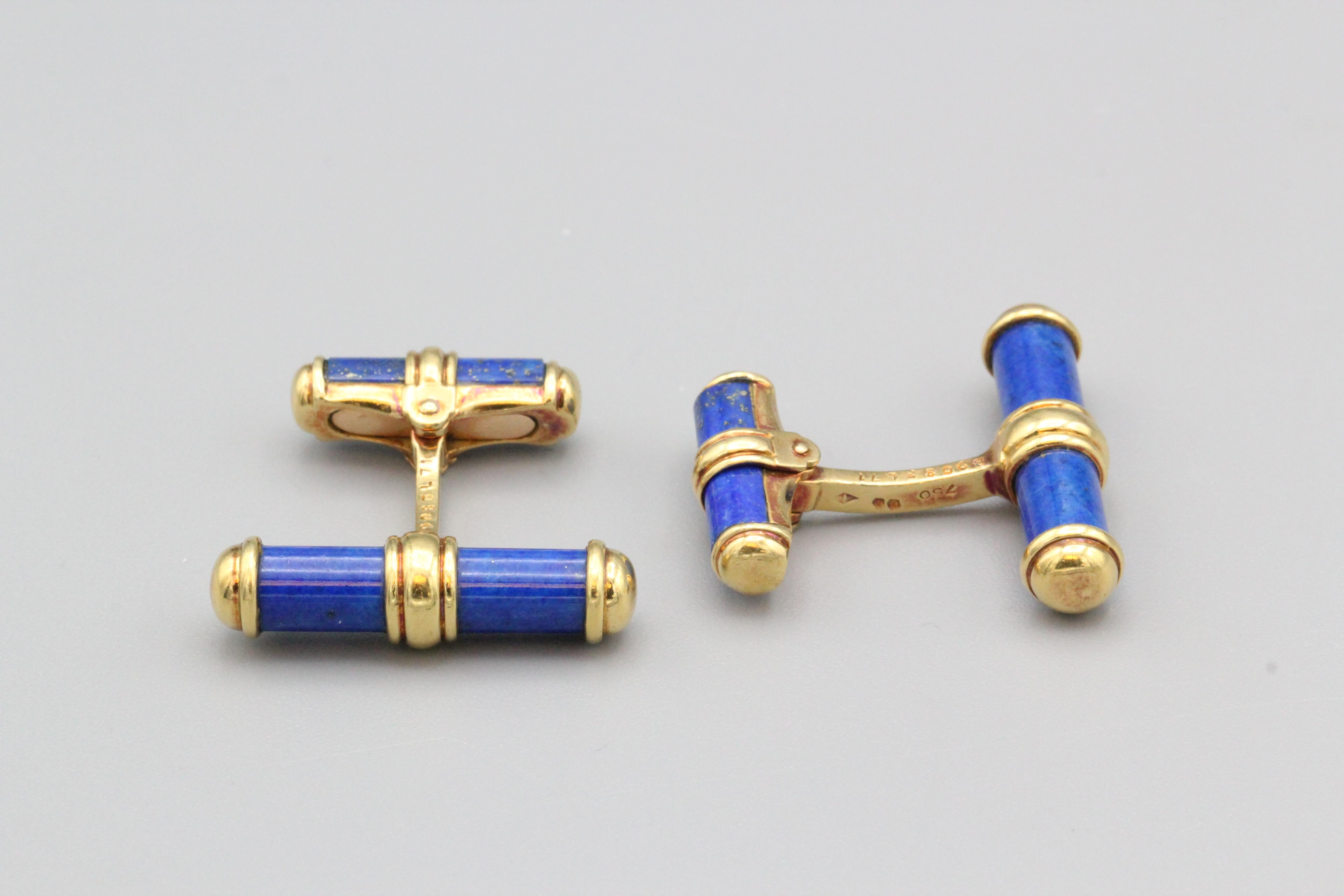 Fine pair of 18K yellow gold and lapis lazuli bar cufflinks by Van Cleef & Arpels.  These cufflinks feature a bar design with lapis inserts; on the opposite side is an easy to use folding bar also set with lapis inserts.  Of very fine quality and