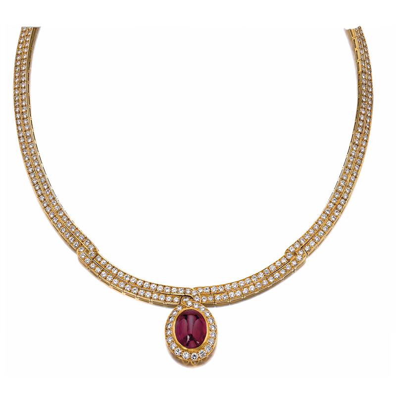 A Ruby and Diamond Necklace by VAN CLEEF & ARPELS set throughout with brilliant-cut diamonds, the front accented with a cabochon ruby, signed Van Cleef & Arpels, numbered, French assay mark for gold and maker's mark. The ruby weighs approximately 14