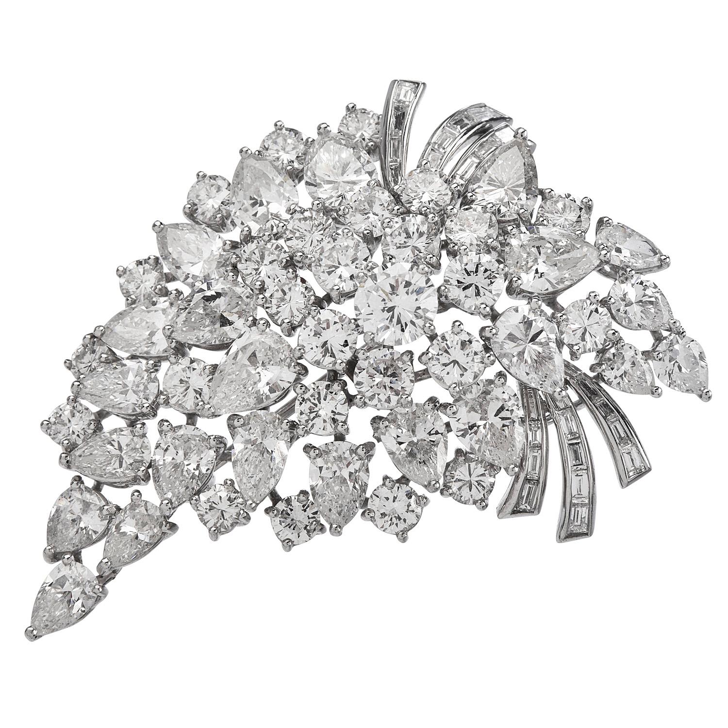 Dazzle yourself with this  Vintage 1970's Elwood Van Clief diamond platinum brooch pin pendant.

Exquisitely crafted in solid platinum, the floral pattern is created by Genuine Diamonds (27) round-cut, 
(23) pear-cut diamonds and (2) small