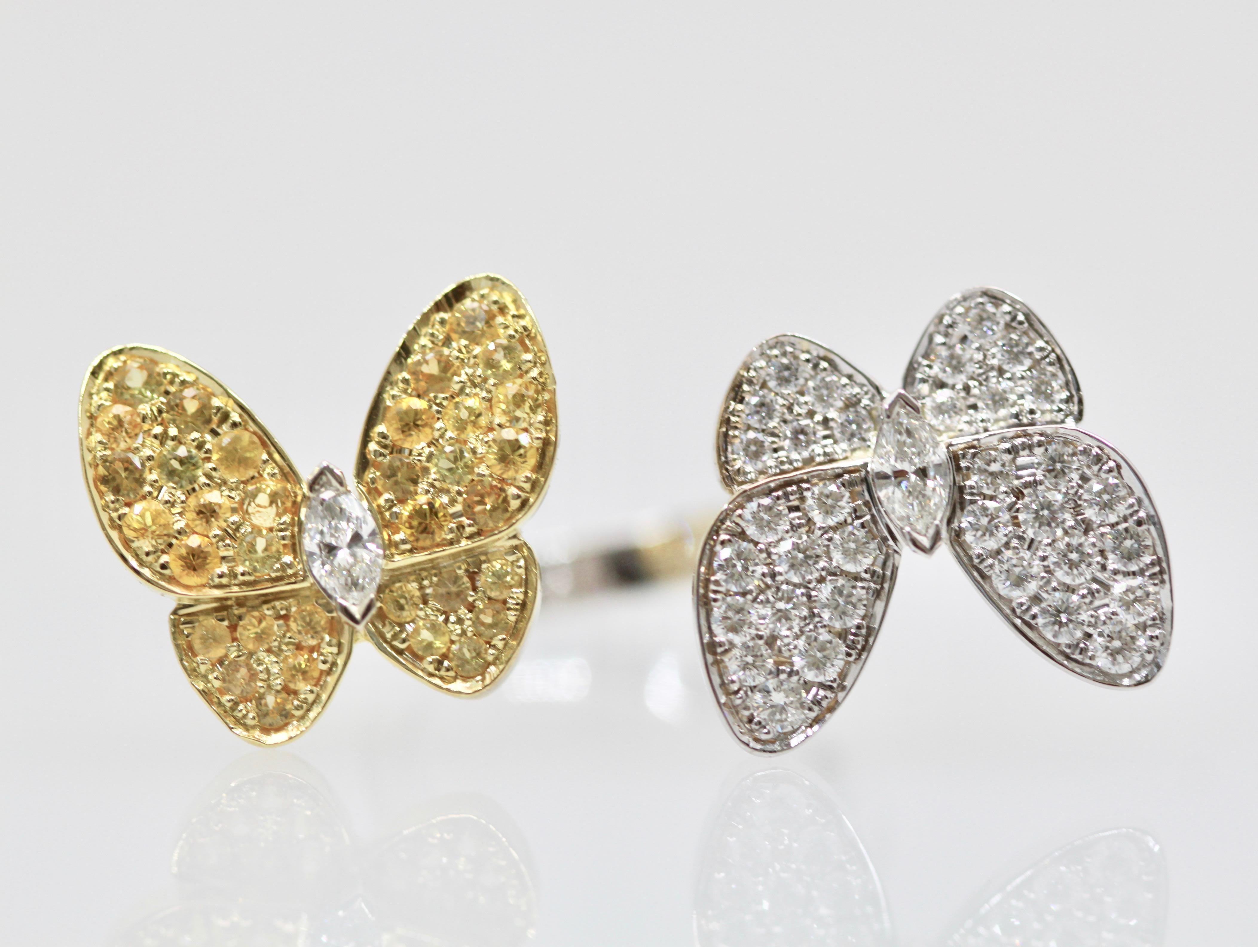 This Van Cleef White Diamond Yellow Sapphire Double Butterfly Ring has seldom been worn and is in wonderful condition.  This is from the flora and fauna collection and it is just beautiful.  The grace of these butterfly dancing in the wind is