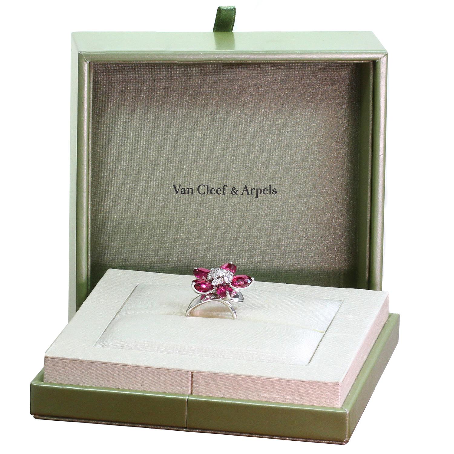 This spectacular Van Cleef & Arpels ring from the vibrant Hawaii collection is designed as a sparkling flower featuring five petals set with graduated oval cut pink rubellites and accented with a central cluster of round brilliant D-F VVS1-VVS2