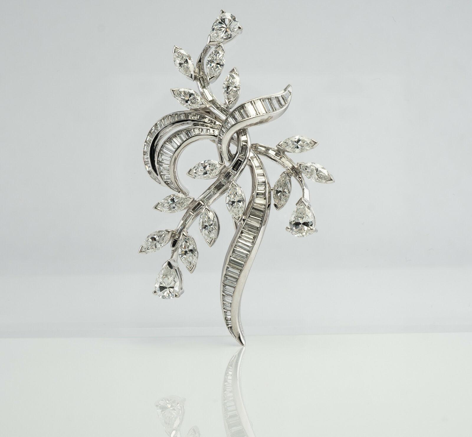 Elwood Van Clief Diamond Flower Pendant Platinum Brooch 7.56 TDW 

Elwood Van Clief a scarce and highly sought-after name in the world of couture jewelry. One can do a search and find pieces such as this one selling on Sotheby's. 

This beautiful