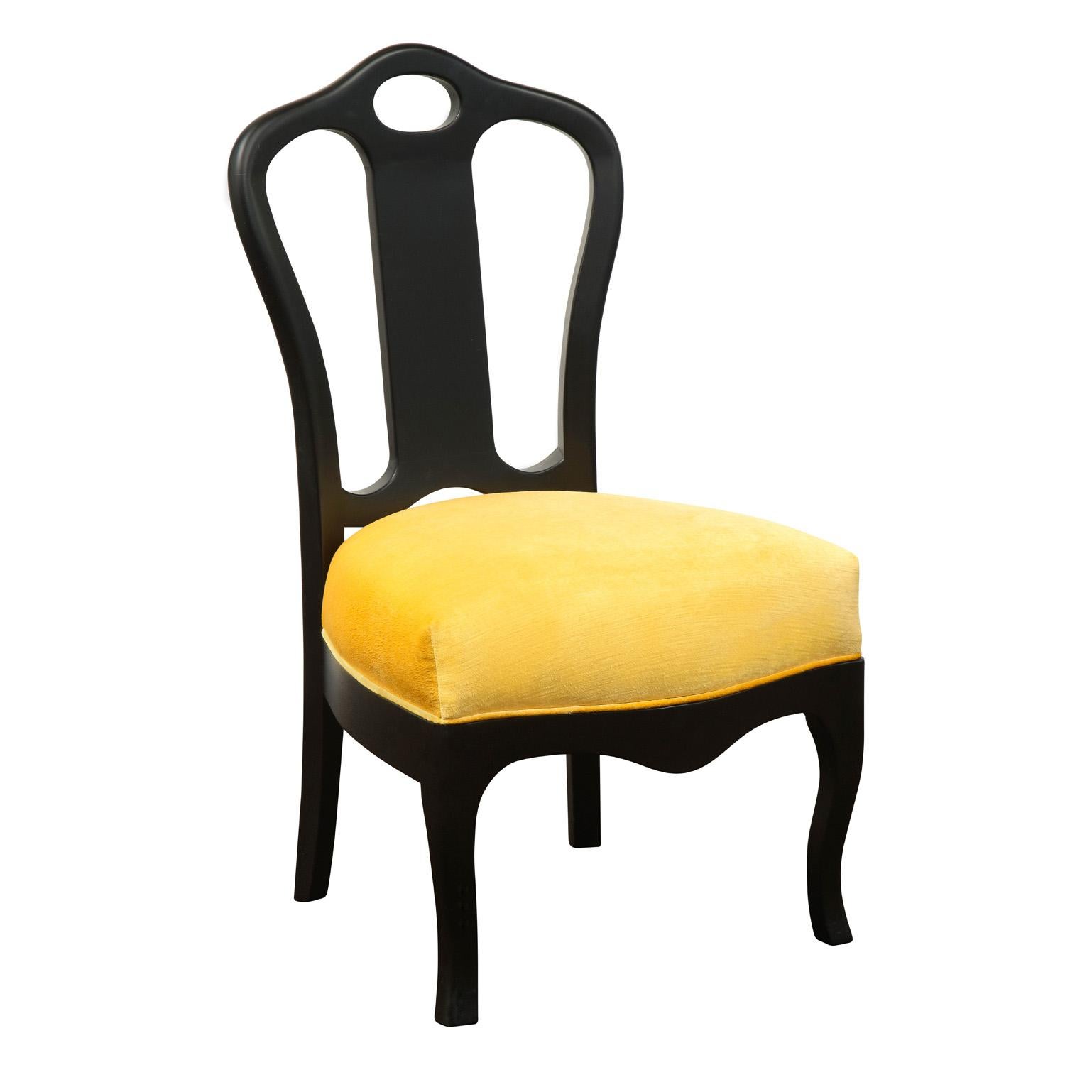 Chic pull up chair in ebonized mahogany with seat newly upholstered in yellow velvet by Van Day Truex in partnership with Harry Hinson, American 1978. This timeless chair is the perfect accent for any room.