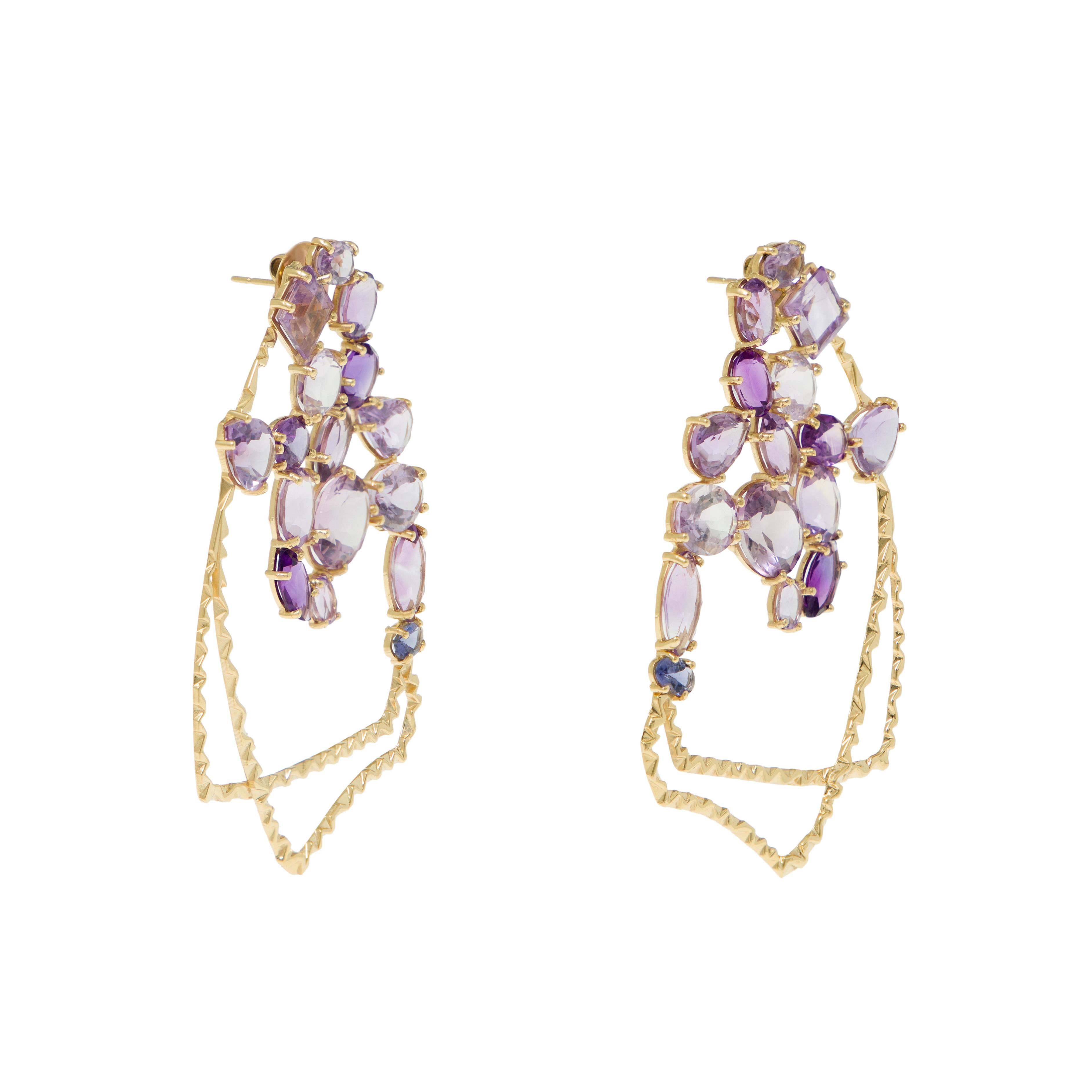 Earrings
Gold 18K
Iolites, Dark, Medium and Light Amethysts
Handmade, bright polished finish, light carved prong setting

A' Design Award (2020-2021) special mention

Amethysts and iolites were used to emulate Van Gogh’s purple carnations in their