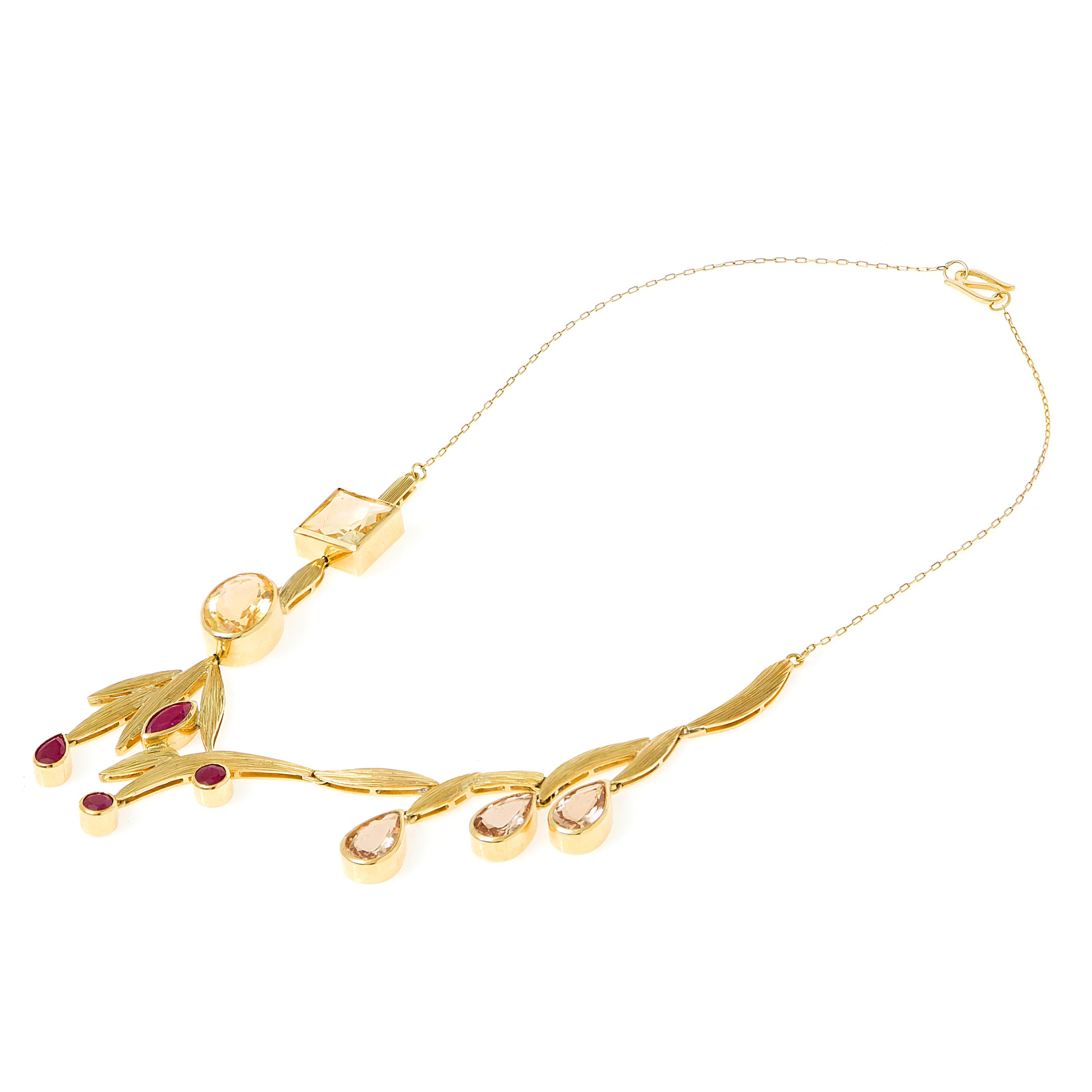Necklace
Gold 18K
Citrine, Ruby and Morganite
Handmade, matte finish and bezel setting

First Place MJSA Vision Awards Winner 2020
Iron A' Design Award Winner 2020-2021

The diversity of the flowers is represented in the gemstones’ different hues