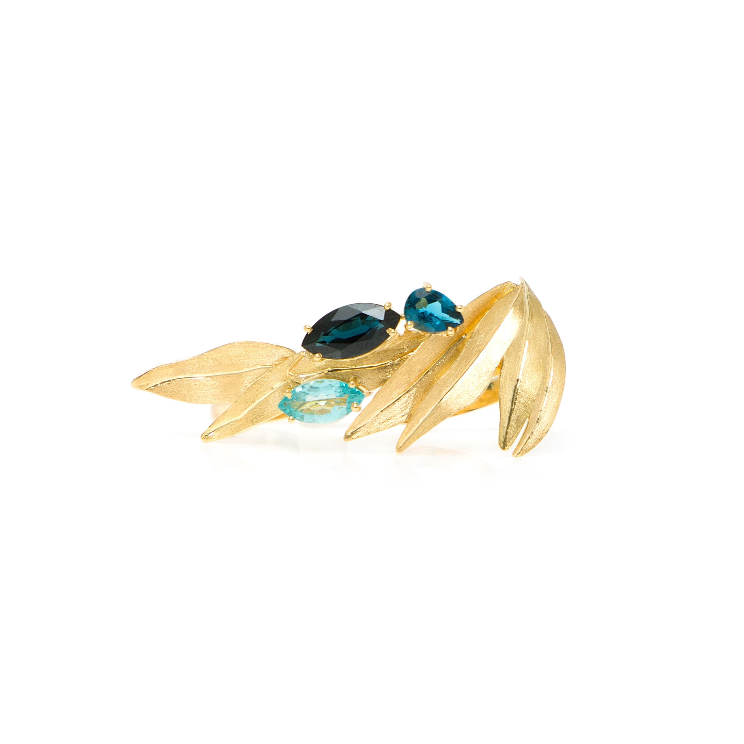 Double Ring 
Sizes: 7.25 and 7.5 (US)
Gold 18K
Blue Sapphire, Blue Topaz (London and Sky)
Handmade, matte finish and prong setting

Van Gogh Irises Ring have blue flowers with sword shaped leaves that are long and laminar.  The flowers are