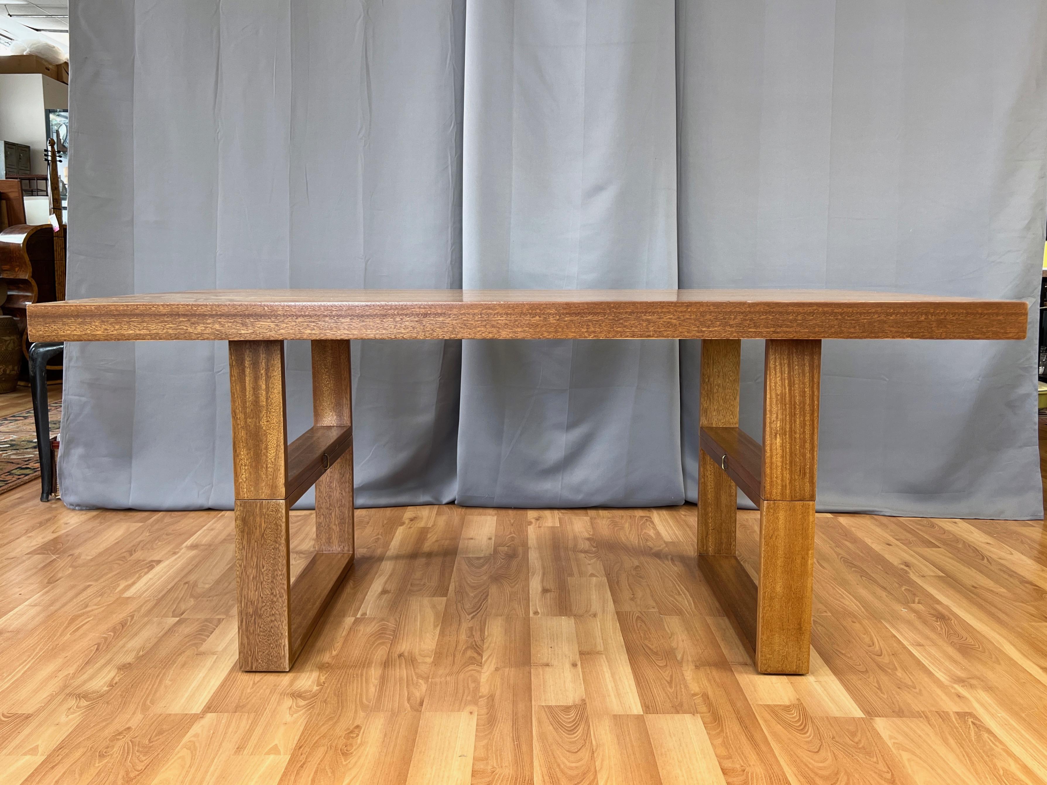 A 1953 mid-century modern mahogany dual-purpose “Camel” dining table and coffee table designed by Hendrik Van Keppel and Taylor Green for Brown-Saltman, with materials crafted by Jasper Wood Products Co.

Notable for its clean, timeless lines and