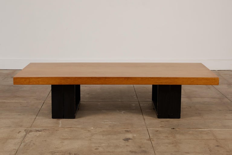 This piece was designed by Hendrik Van Keppel and Taylor Green for Brown Saltman. It features a mahogany table top with black legs that can convert from a coffee table to a dining table, work table or desk.
The legs are hinged to fold down and can