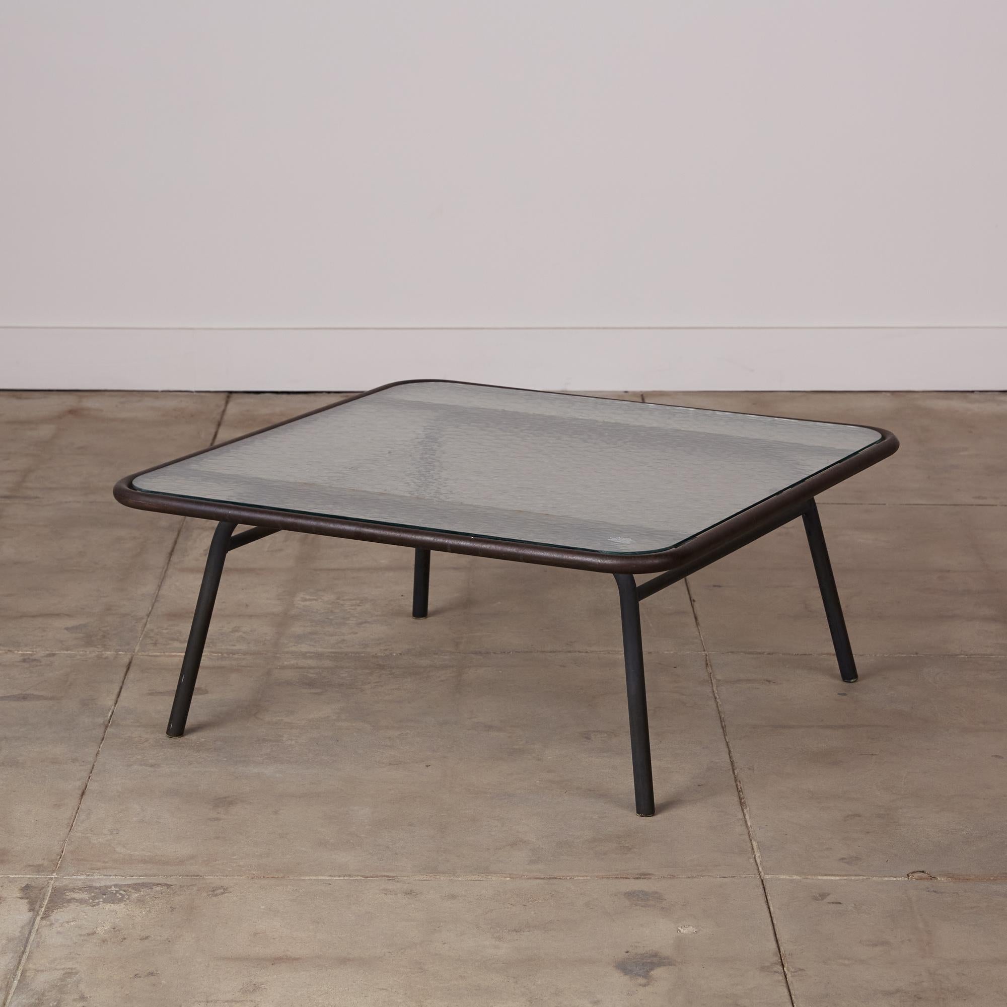 Rare patio coffee table by Hendrik Van Keppel and Taylor Green, also known as Van Keppel-Green or VKG. The table features a tubular metal frame with the original pebble glass.

Measurements: 35