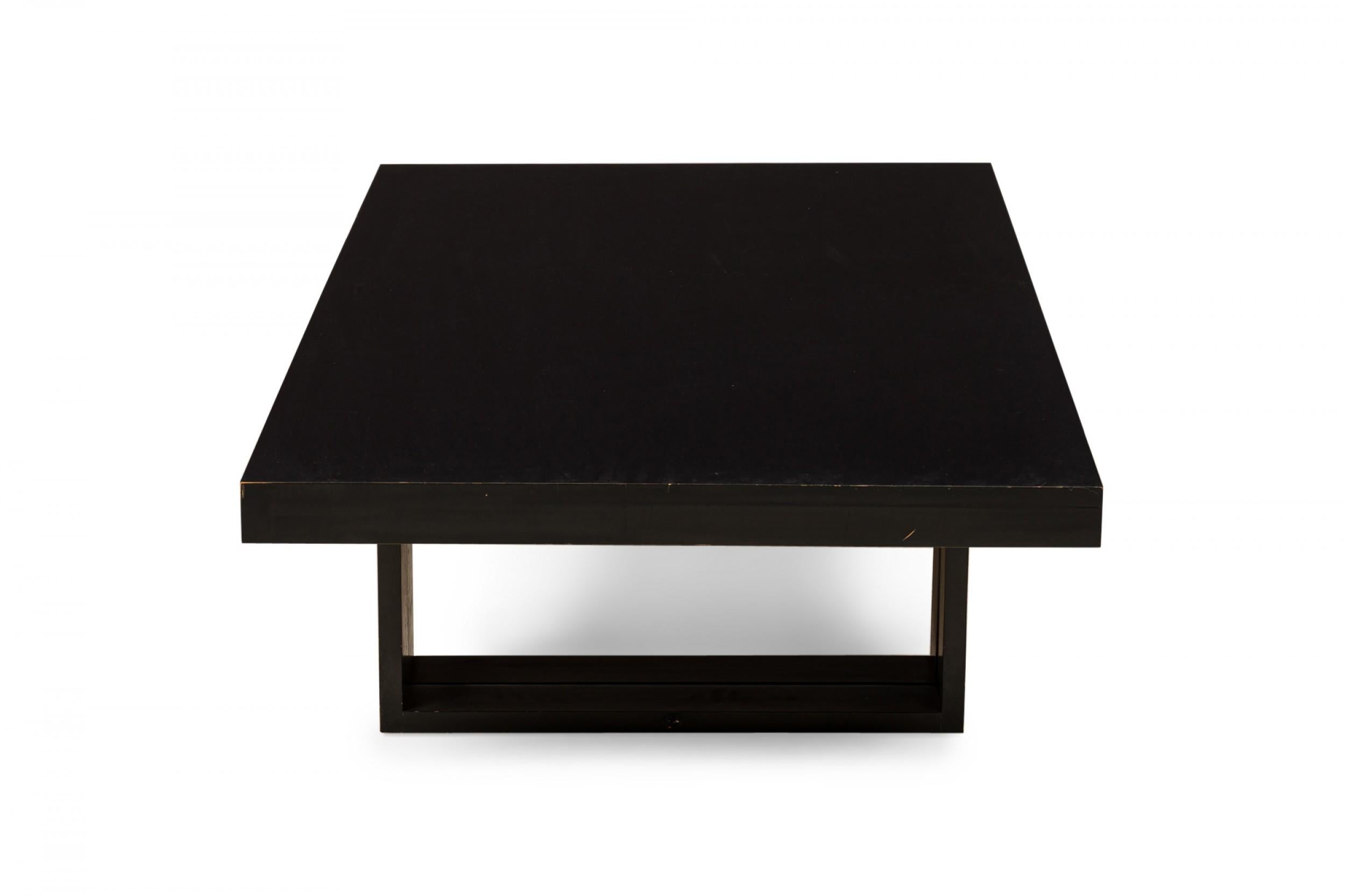 American Mid-Century rectangular ebonized wooden 'Camel' coffee / cocktail table resting on two sets of bracket-shaped legs that raise to convert to a dining table. (VAN KEPPEL GREEN, VKG)
