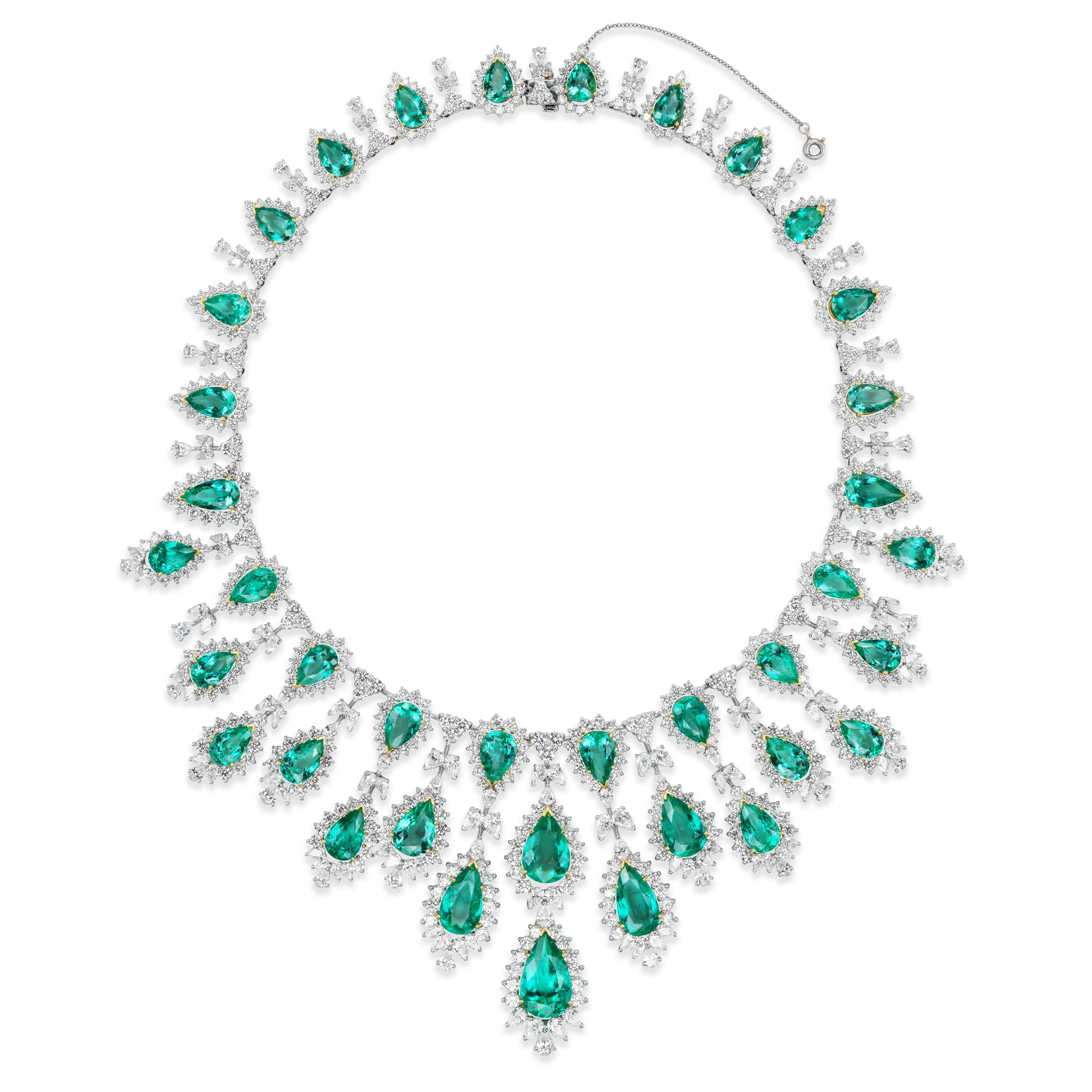 The Van Necklace & Earrings Suite is a ethereal depiction of nature. It is named after the Sanskrit word for forest - Van (pronounced akin to 'one'). The fine Colombian Emeralds juxtaposed with scintillating diamonds come together to create a suite