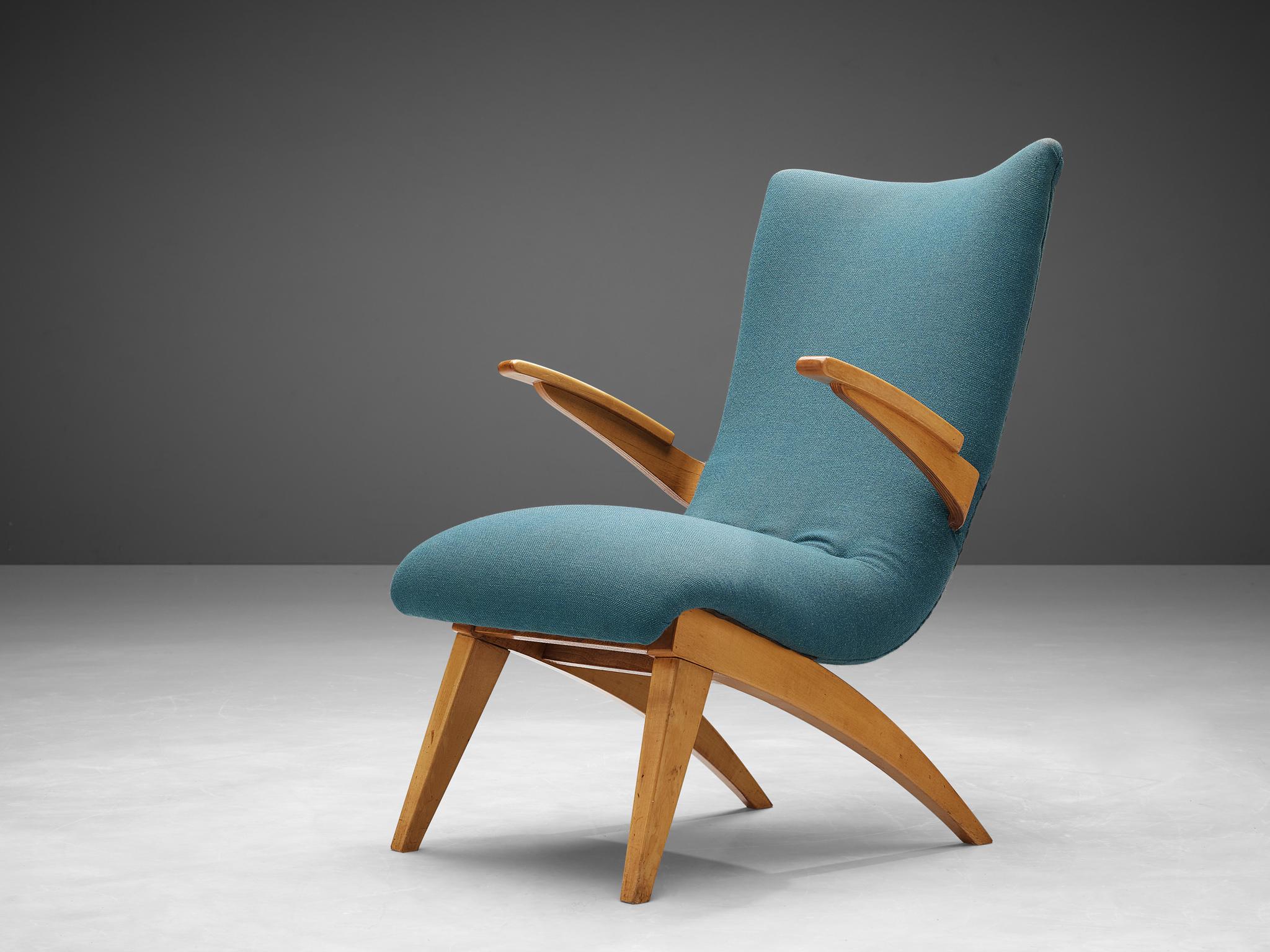 G. Van Os for Van Os Culemborg, lounge chair, beech, fabric, The Netherlands, 1950s

This easy chair is designed by G. Van Os in the Netherlands. The lounge chair, executed in beech and blue fabric upholstery, has a backrest that is tilted in order