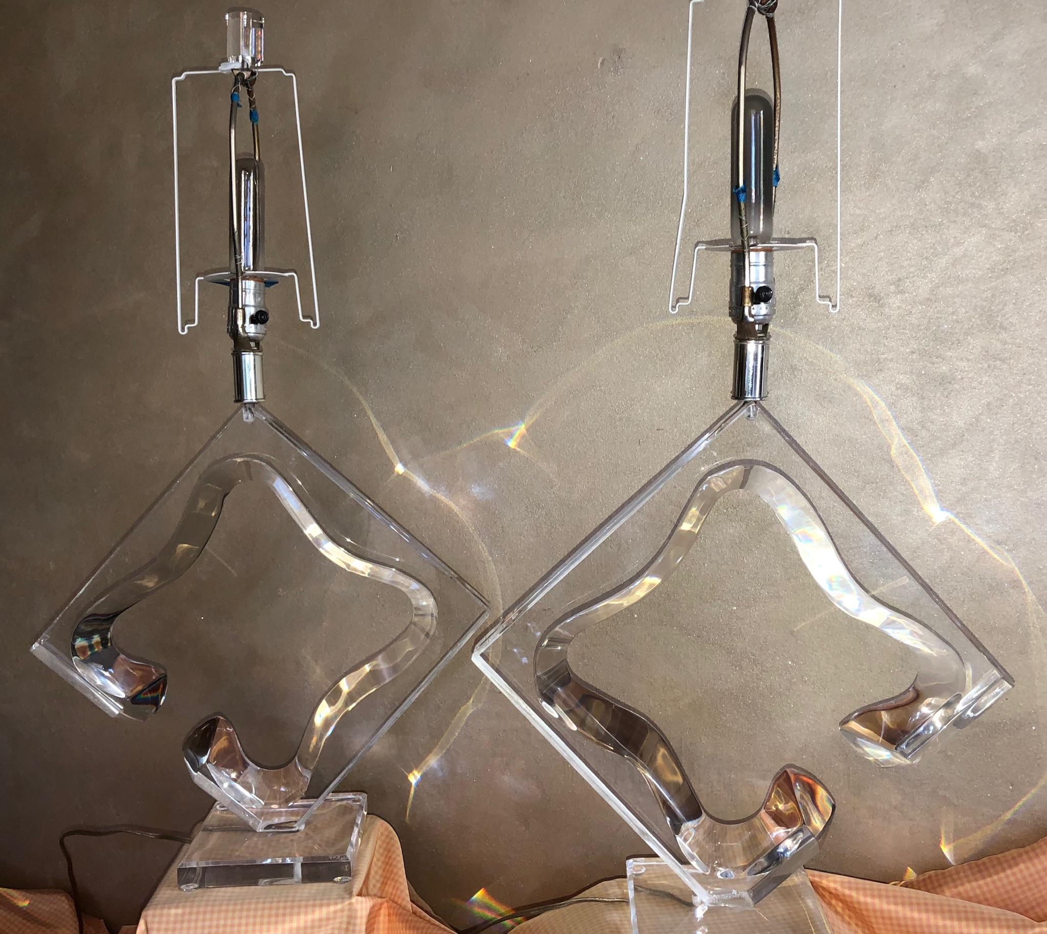 Pair of large and imposing abstract sculptural Lucite lamps, signed by Hivo Van Teal circa 1970. This style is perhaps his most iconic (he also made similar sculptures). This lamp is hard to find in pairs, especially in such prime condition. Hivo