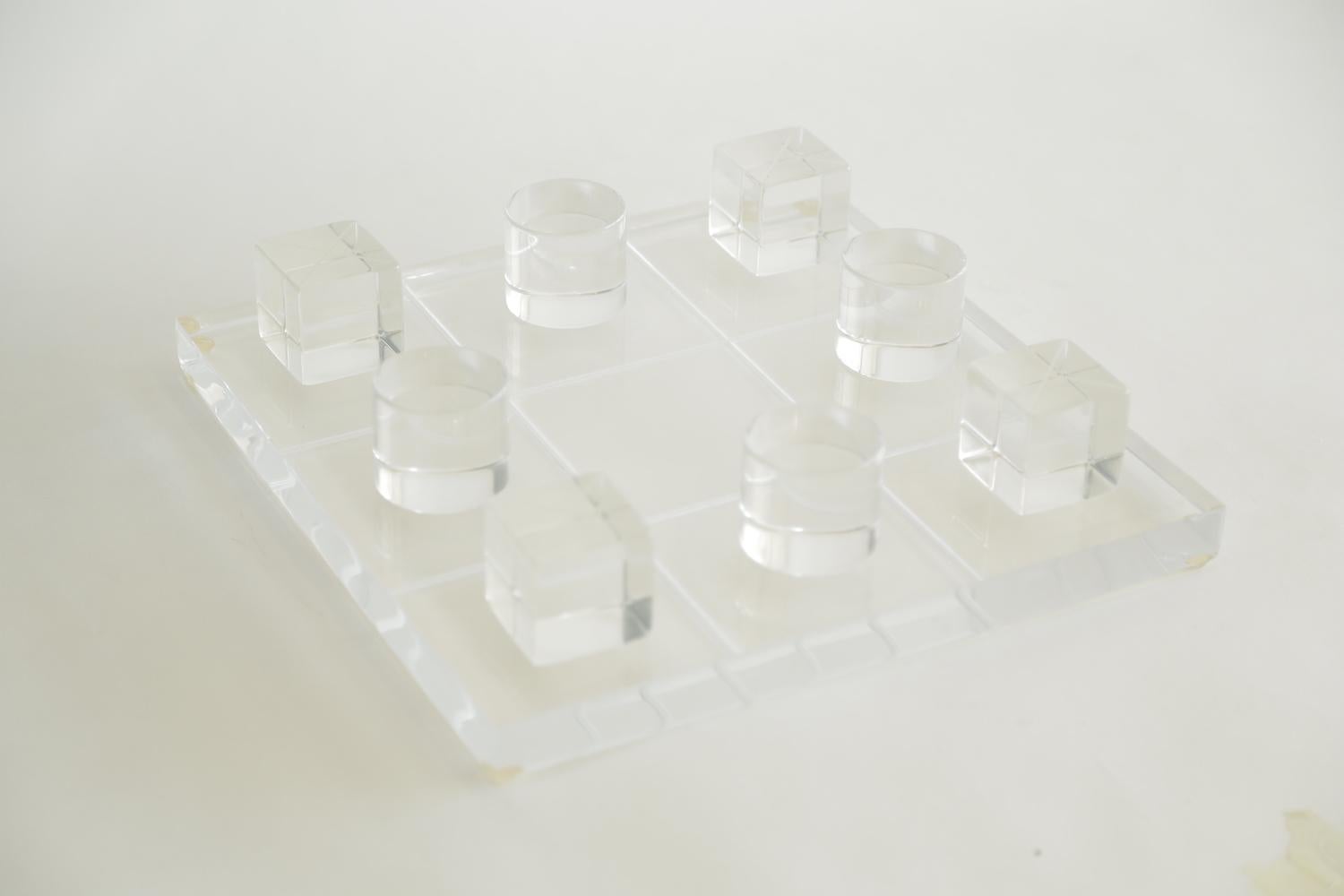 This clear thick lucite signed vintage tic tac toe set by Van Teal is the larger version made from the time period. It is vintage from the 1970s. Great as a desk accessory or cocktail table game object. The board is 12 x 12