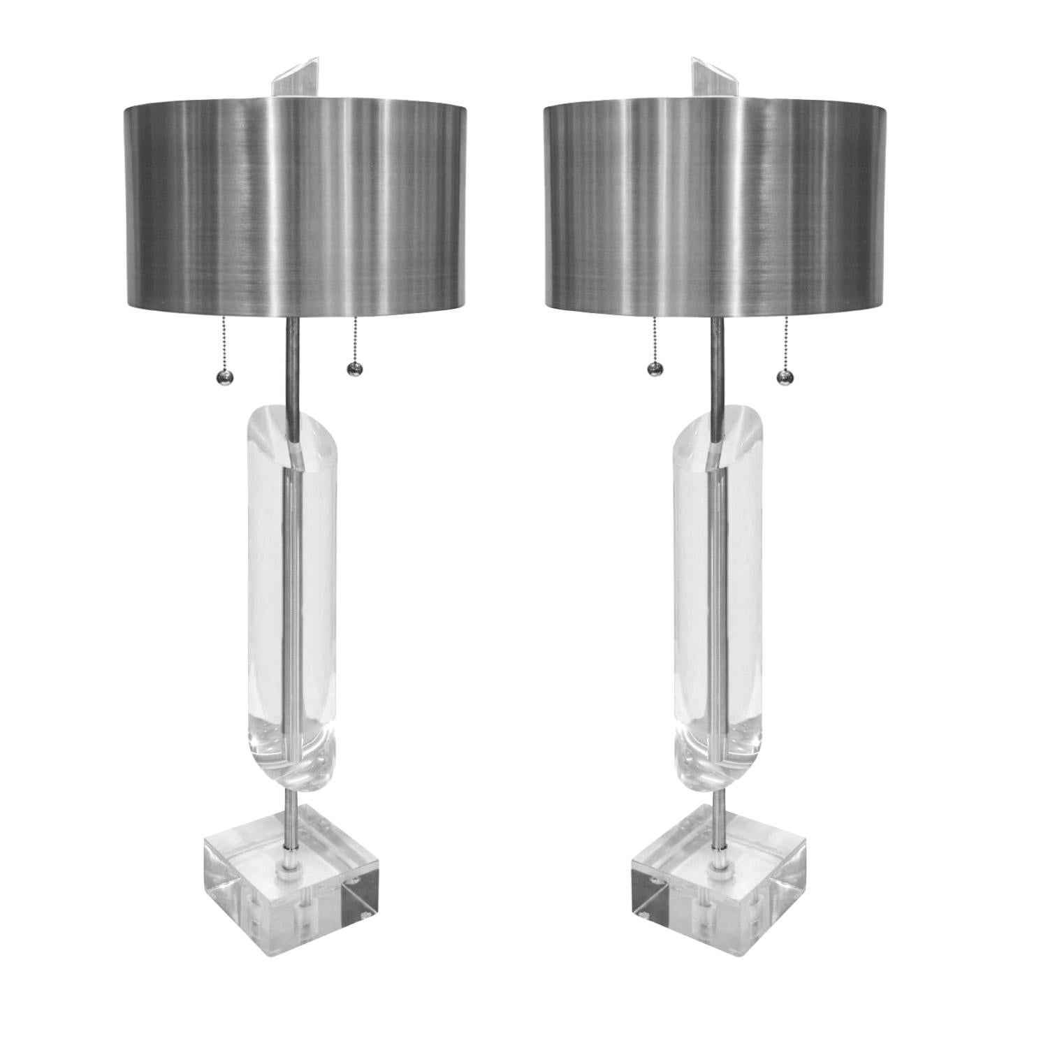 Pair of large artisan sculptural table lamps in solid Lucite with hand-spun brushed aluminum shades and hardware by Van Teal, American 1970s (signed “Van Teal” on bases). Lamps have been professionally cleaned, polished and rewired with silk cords