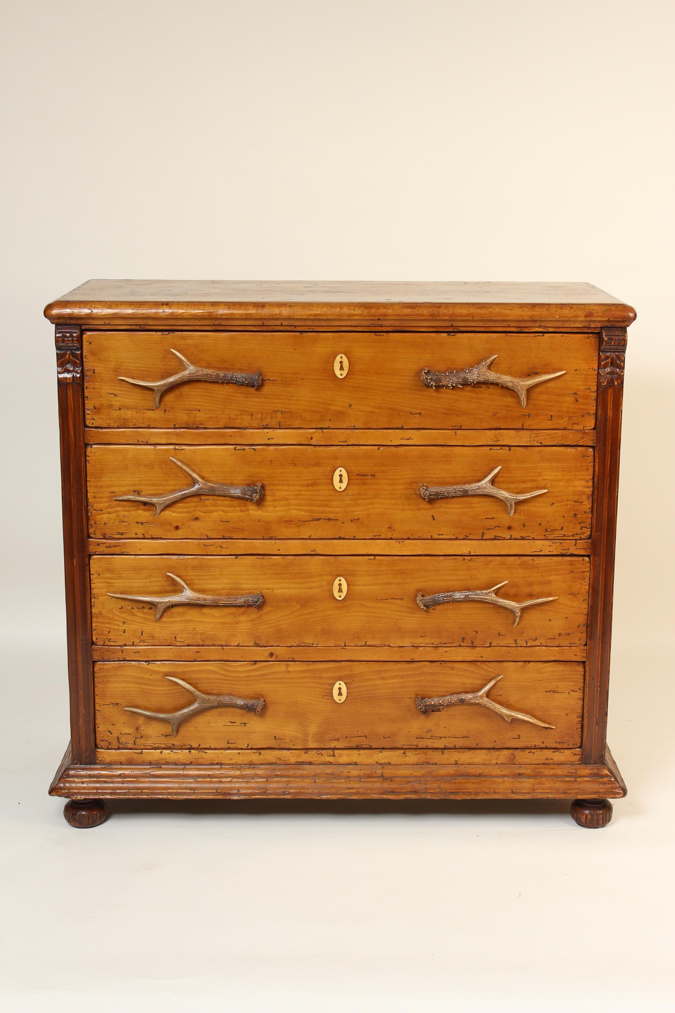 Victorian style pine chest of drawers with deer antler pulls, made from antique pine by Van Thiel & Company, early 21st century. This chest was made from antique pine in China under European management. This chest would be a great addition to either