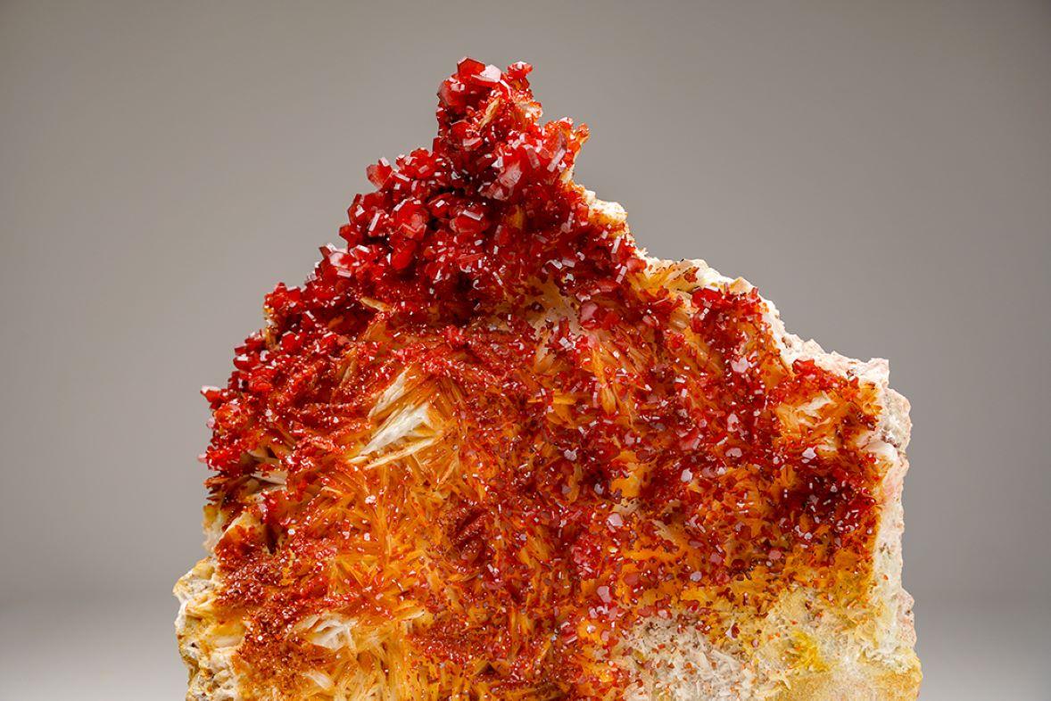 From Mibladen, Atlas Mountains, Khénifra Province, Morocco 

Here is an exceptional world class specimen of a cluster of hexagonal crystals of bright red Vanadinites with glassy luster on barite matrix. Large well defined undamaged crystals, fully