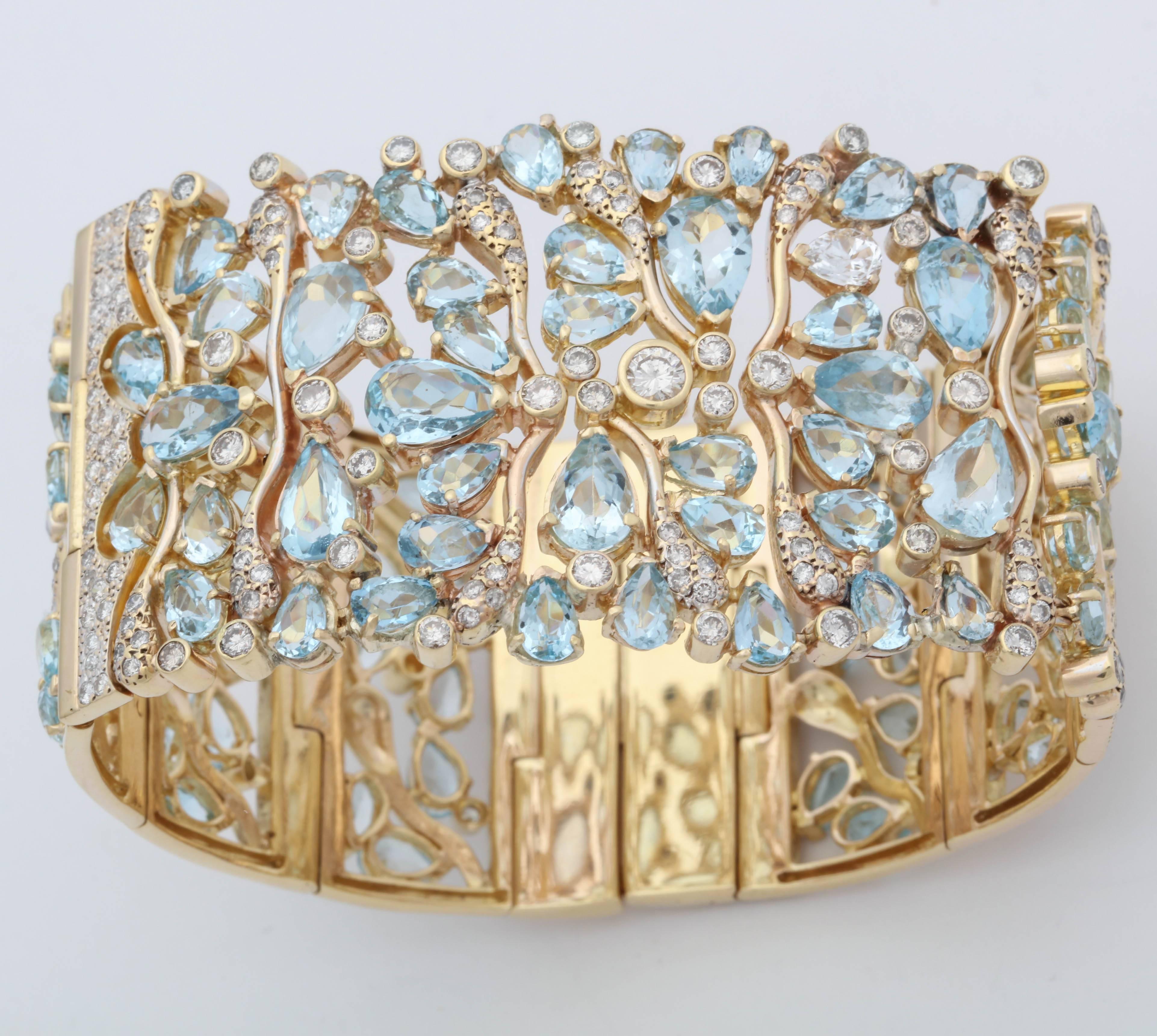 One Large And Impressive Flexible 18kt Yellow Gold  Heavy Link Panels Bracelet Embellished With Numerous Pear Shaped  Beautiful Pastel Color Aquamarines Weighing Approximately 20 Carats Total Weight,Further Designed With Numerous High Quality Full