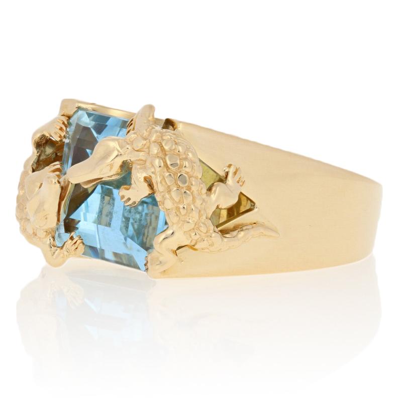 This ring is a size 7.

Brand: Vancox

Metal Content: Guaranteed 18k Gold as stamped

Stone Information: 
Genuine Aquamarine
Treatment: Heating  
Color: Blue 
Cut: Rectangle  
Carat: 6.36ct

Style: Cocktail Solitaire 
Face Height (north to south):