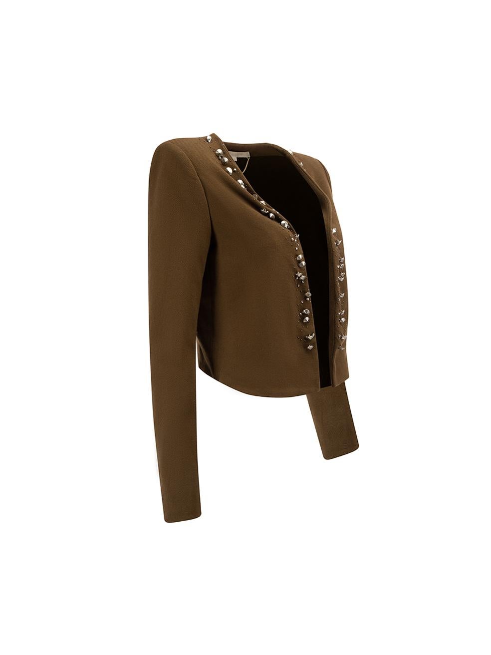 CONDITION is Very good. Minimal wear to jacket is evident. Minimal wear to embellishment with wear to spike studs on this used Vanessa Bruno designer resale item.



Details


Brown

Cotton

Cropped jacket

Open front

Studs and gemstone
