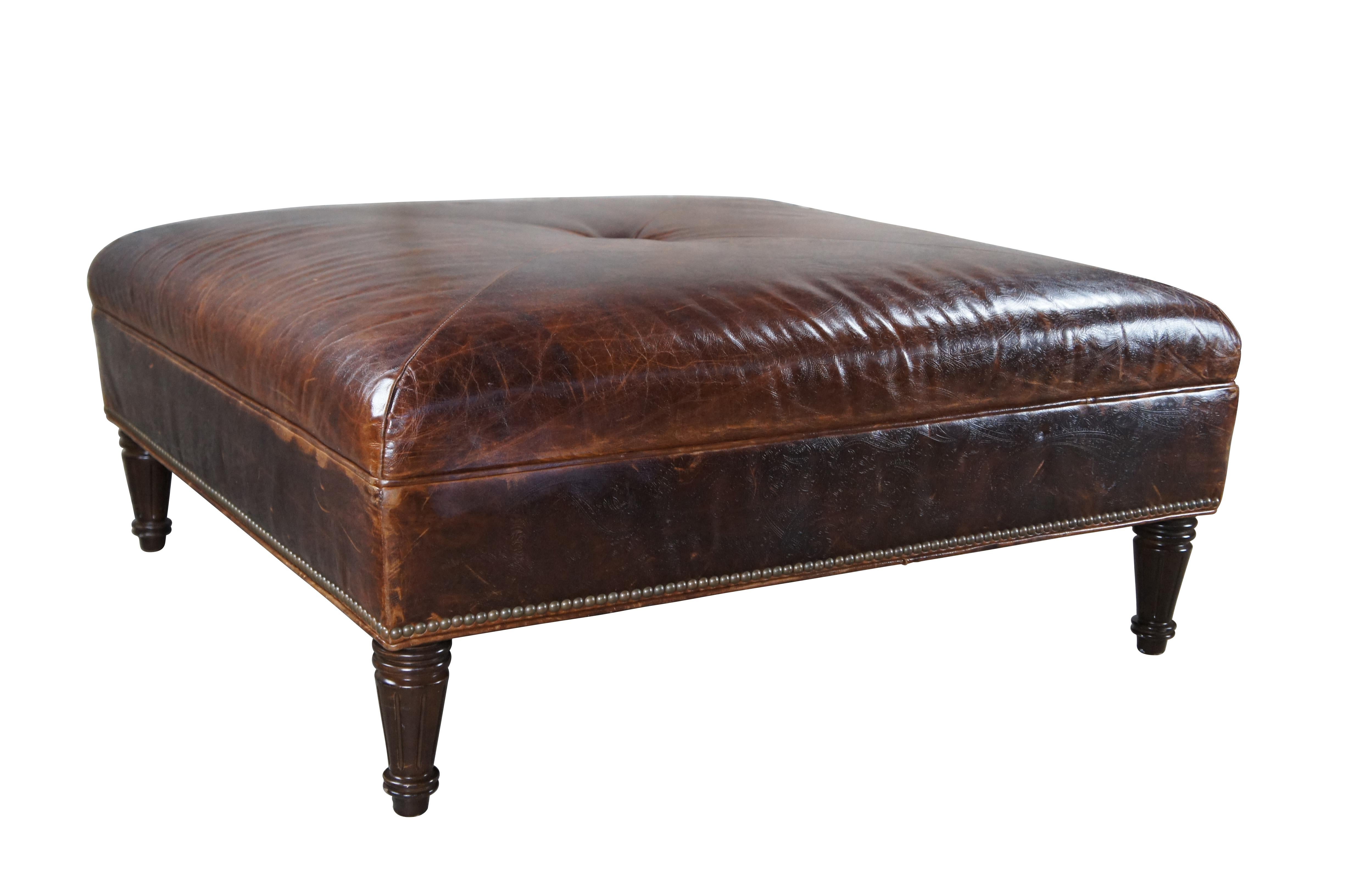 Vintage Vanguard brown leather square ottoman featuring mitered paisley and nailhead design with button tuft.

Vanguard Furniture is a family-owned company that has been making custom furniture since 1969. They have six manufacturing buildings in