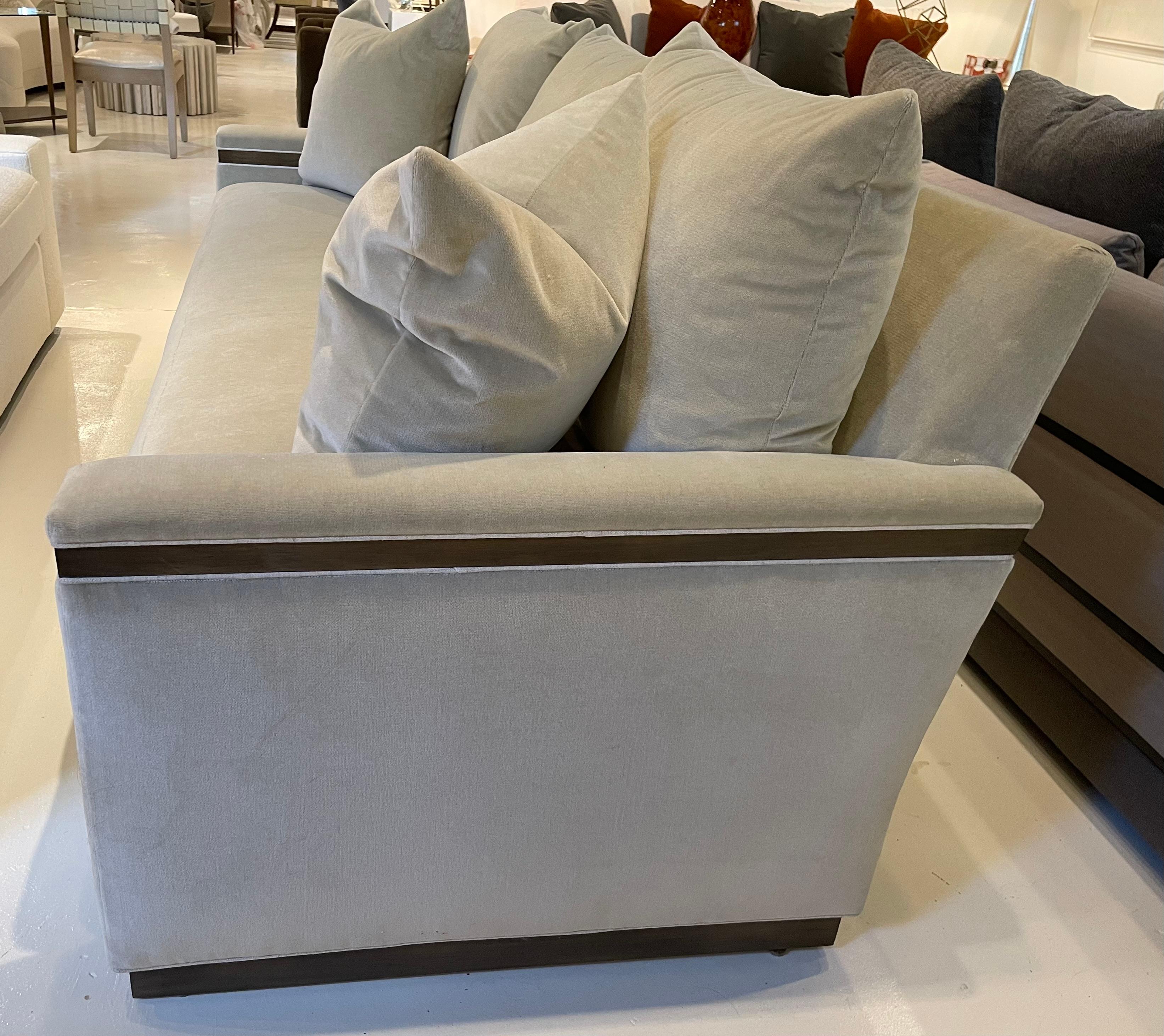 Vanguard Envision Sofa - Showroom New.  Covered in a rich, neutral, taupe, faux mohair velvet with a contrast welt.  The capped arm is trimmed in wood detail.  The sofa has a spring down bench seat and a plinth base.  8-way hand tied seat
