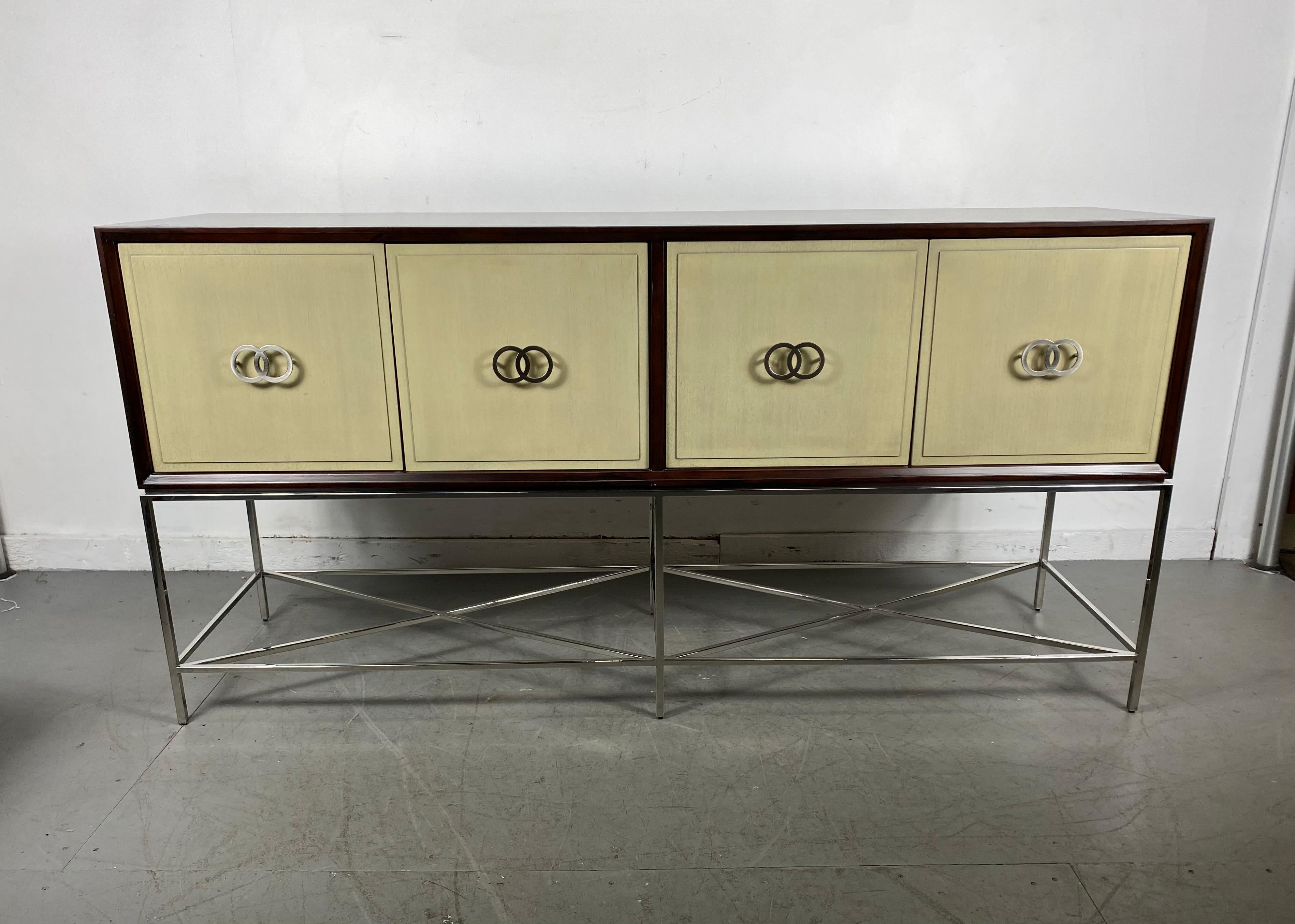 Vanguard furniture Michael Weiss kingsley sideboard / contemporary modernist

Details:

Collection: Michael Weiss
Two glass shelves
Four doors
Hardware: brushed nickel
Materials: African walnut solids and veneers ,,,,,,,,,,,,,,,,,,,,, hand