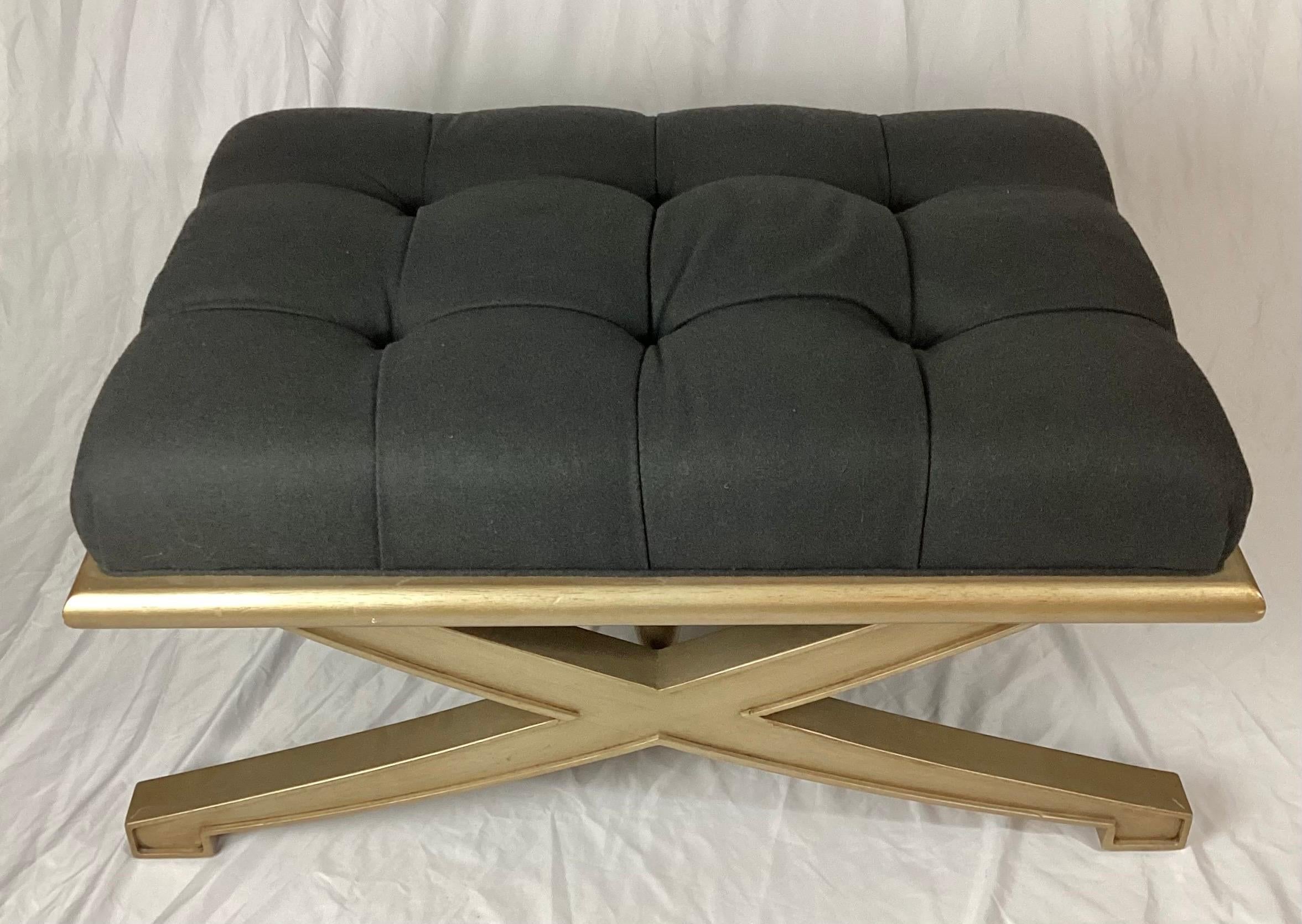 Vanguard Lytton ottoman with grey flannel tufted seat and metallic gold painted base. Nice size for a coffee table bench or just extra seating in a room. Some very minor age appropriate scuffs to the gold.