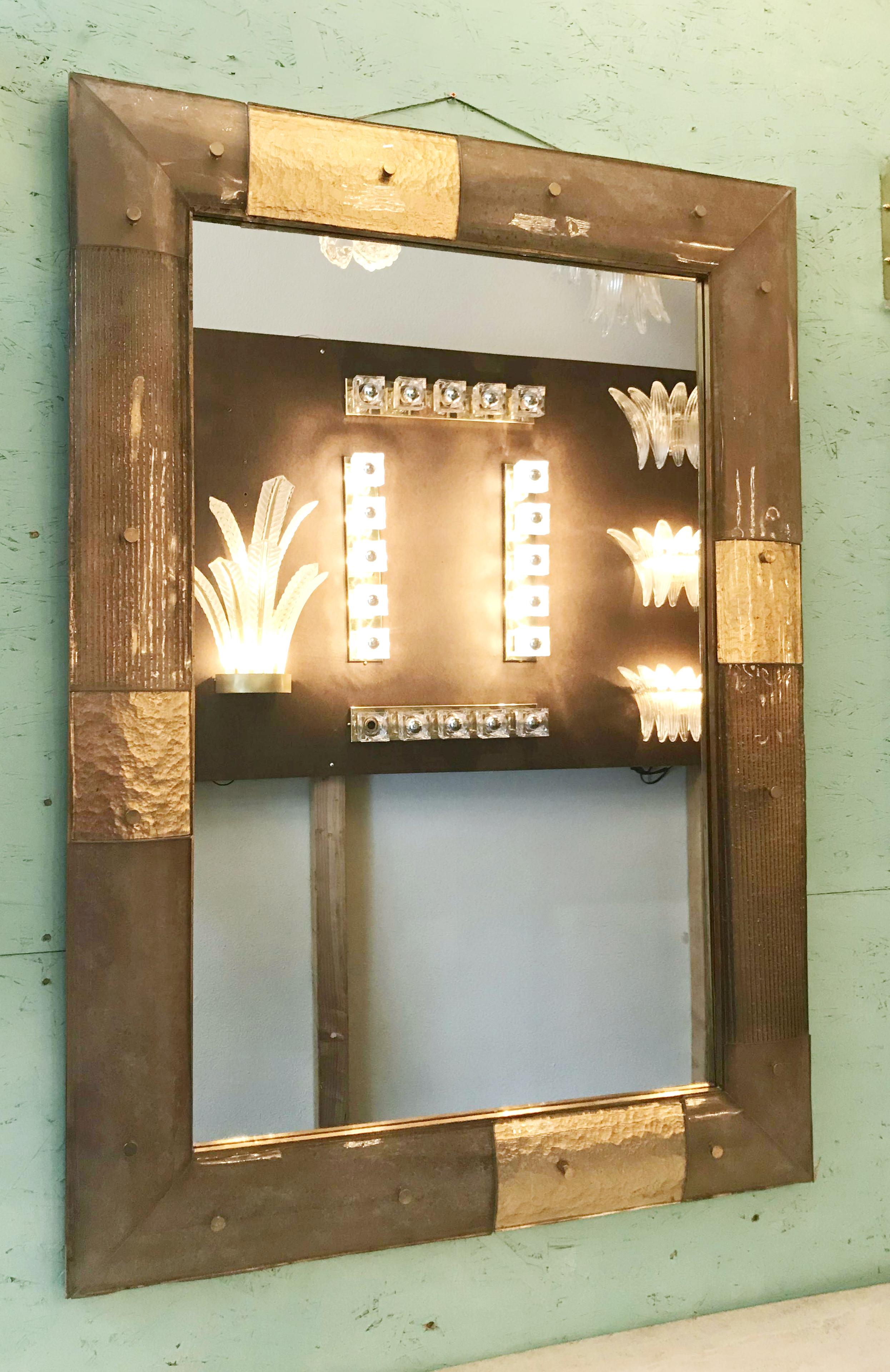 Italian rectangular mirror made of Murano glass and brass details by Fabio Bergomi for Fabio Ltd. Each glass is hand finished with different effects: gold leaf, ribbed and frosted.
Depth: 1.5 inches / Width: 34.5 inches / Height: 48.5 inches
Order