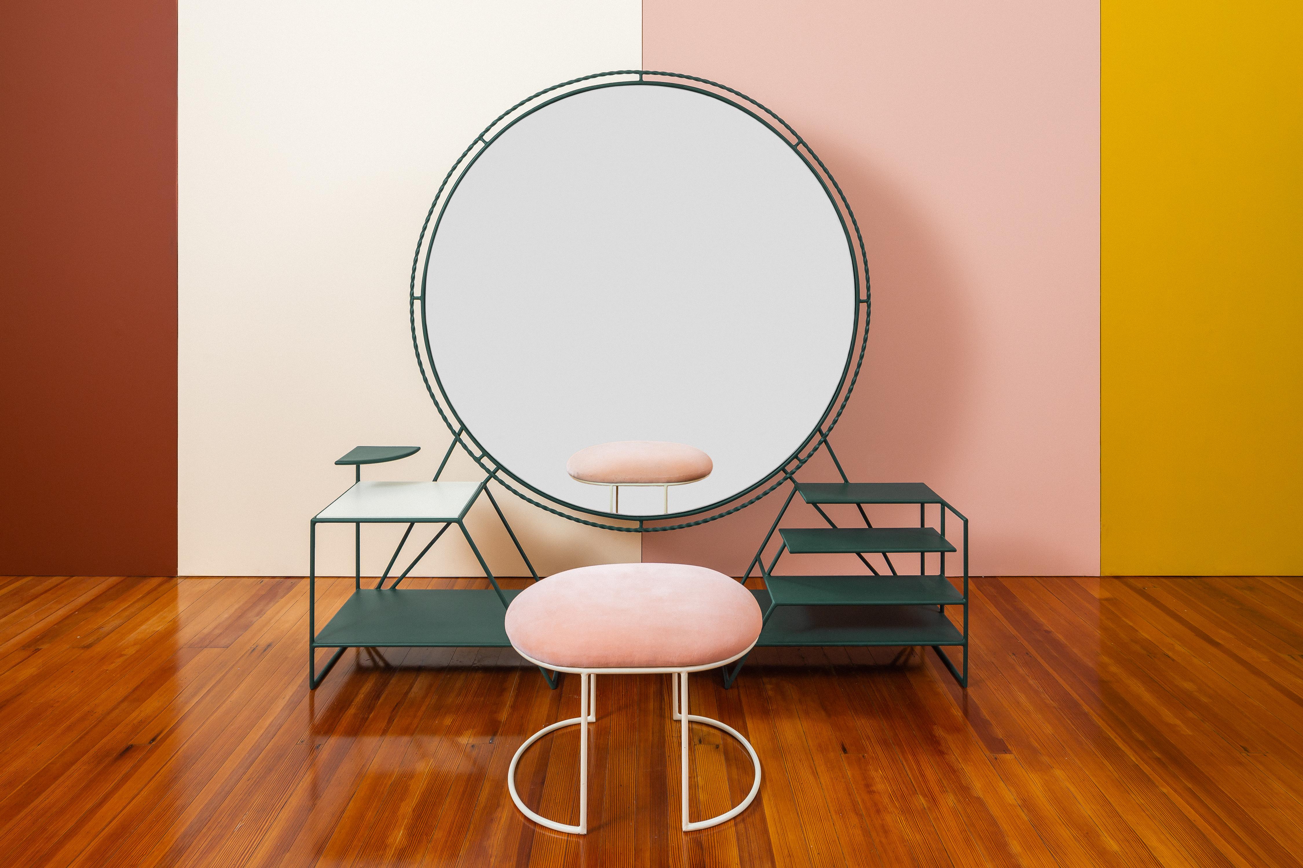 Vanity and ottoman by Sofia Alvarado
Unique Piece
Materials: Metal base, Guayacan wood, mirror glass
Dimensions: 158cm (H) x 160cm (W) x 35cm (D) / 50 x 40cm ottoman
Green, ivory and pink.

FI is an ornamental artist who embodies the creative