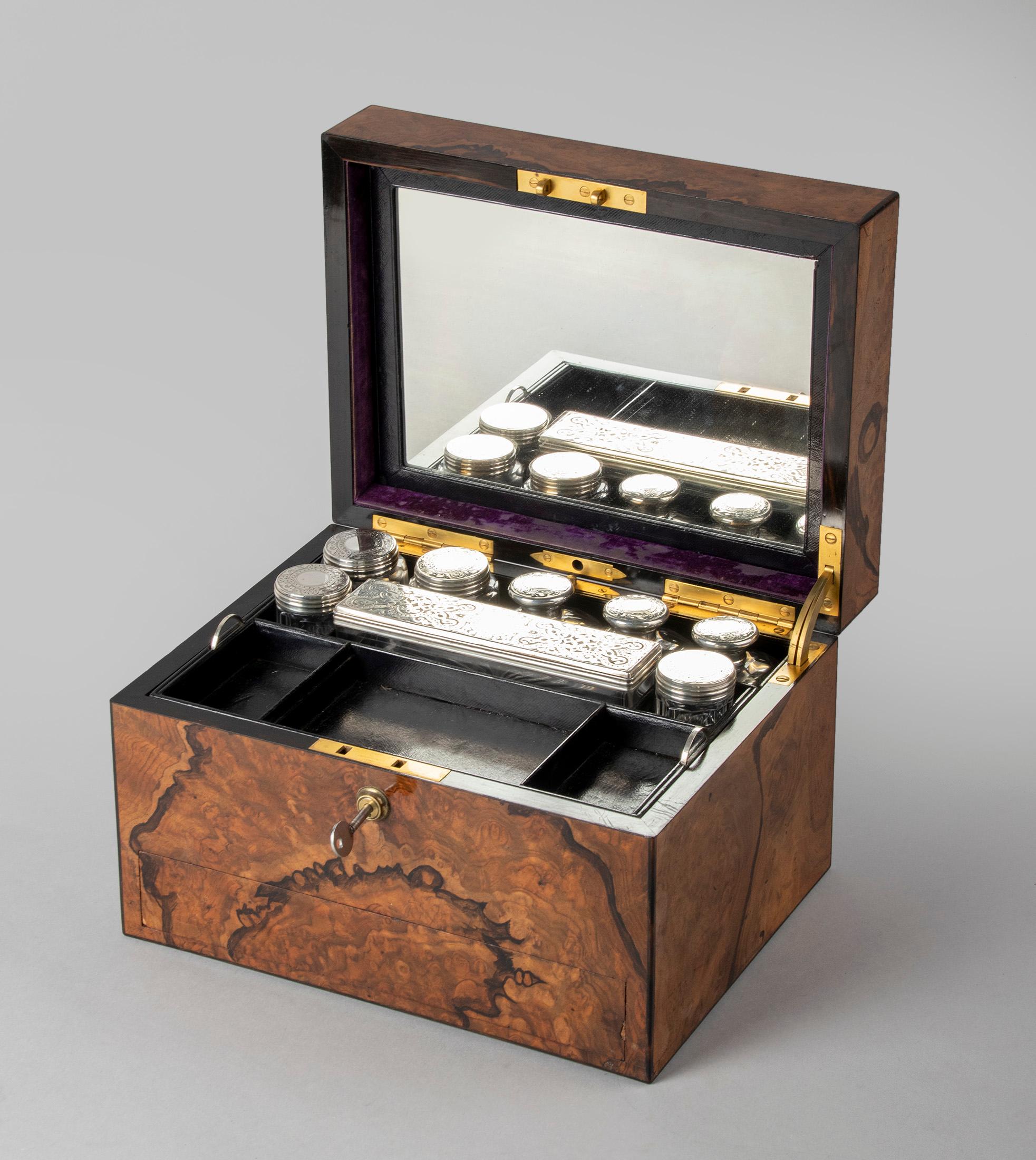 Beautiful feathered walnut, brass bound, vanity box by the famous makers “Betjemann & Sons” of London. This vanity box has several compartments and the attention to detail is fabulous. The walnut veneer has been enhanced using a feather and ink to
