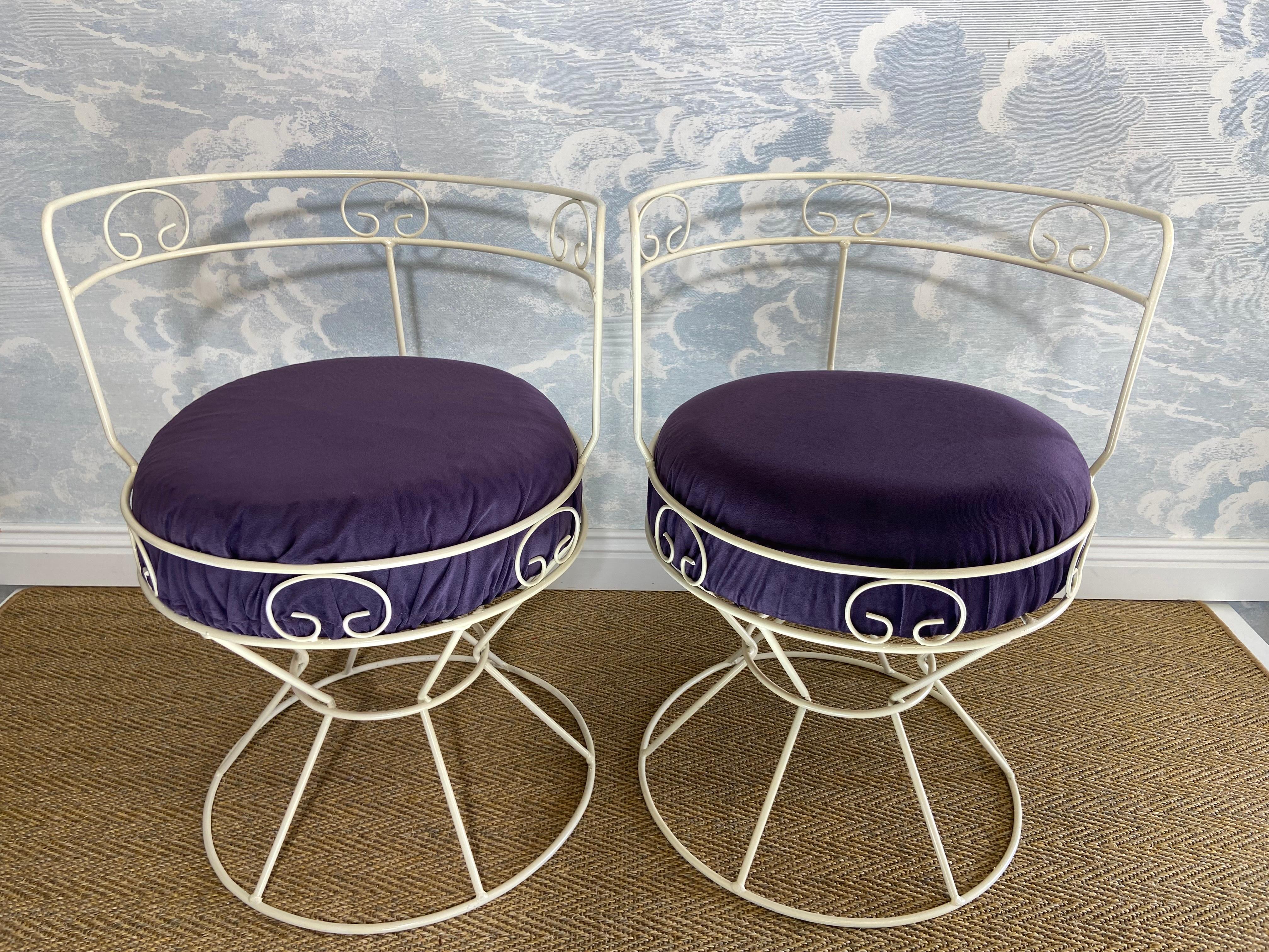 This pair of romantic vanity chairs with ornate white metal frames and cushioned seats probably hails from France in the 1960's. We were advised by the previous owner that they came out of an ice cream parlor their family used to run.

The chairs