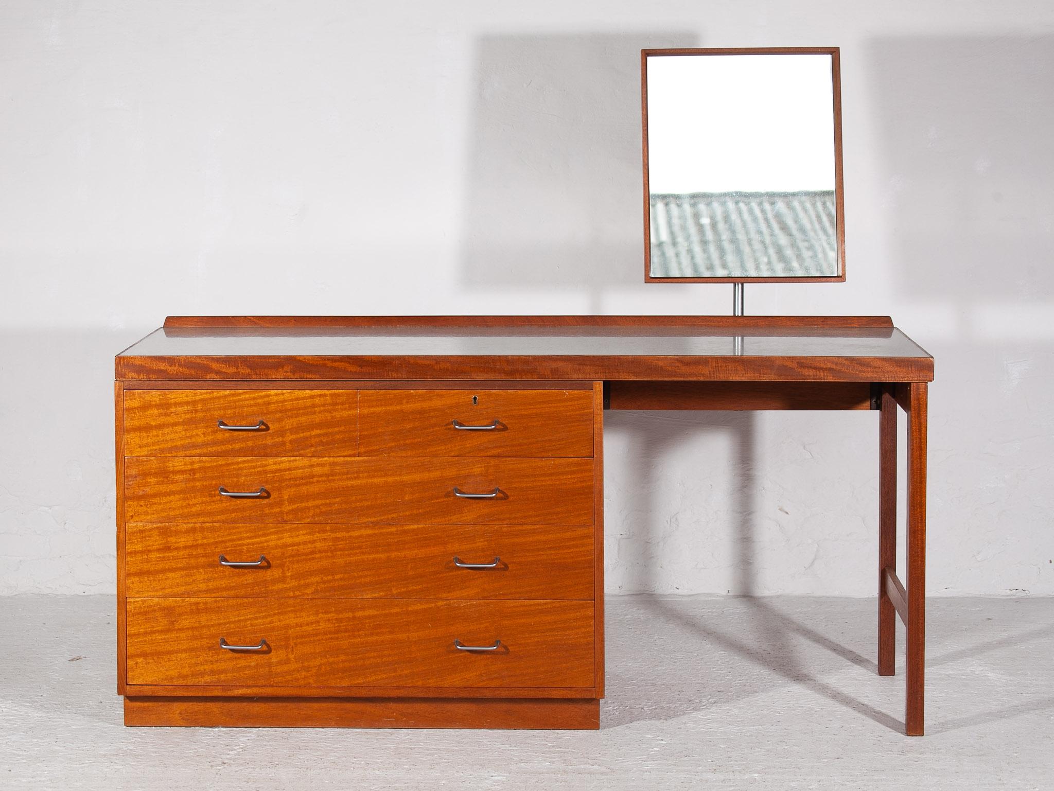 Frank Guille mid-century dressing table 1970's with chest of drawers and adjustable mirror for different positions. Beautiful shaped dressing table or Vanity. It is made of solid and veneered teak wood. This high quality cabinet has very nice