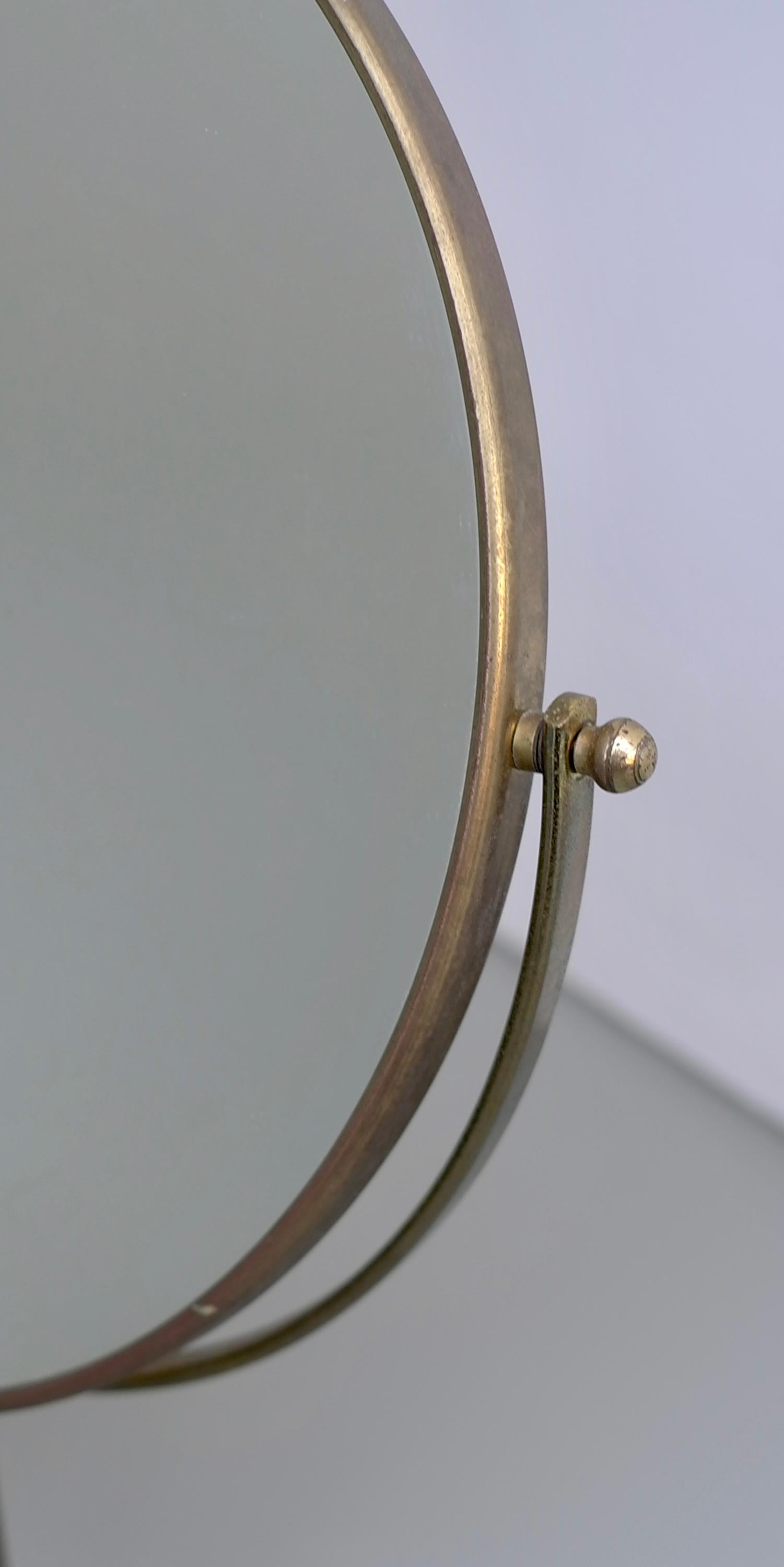 Vanity make up table mirror in brass, France, 1940s.

Mirror on both sides, one normal and the other for close up.