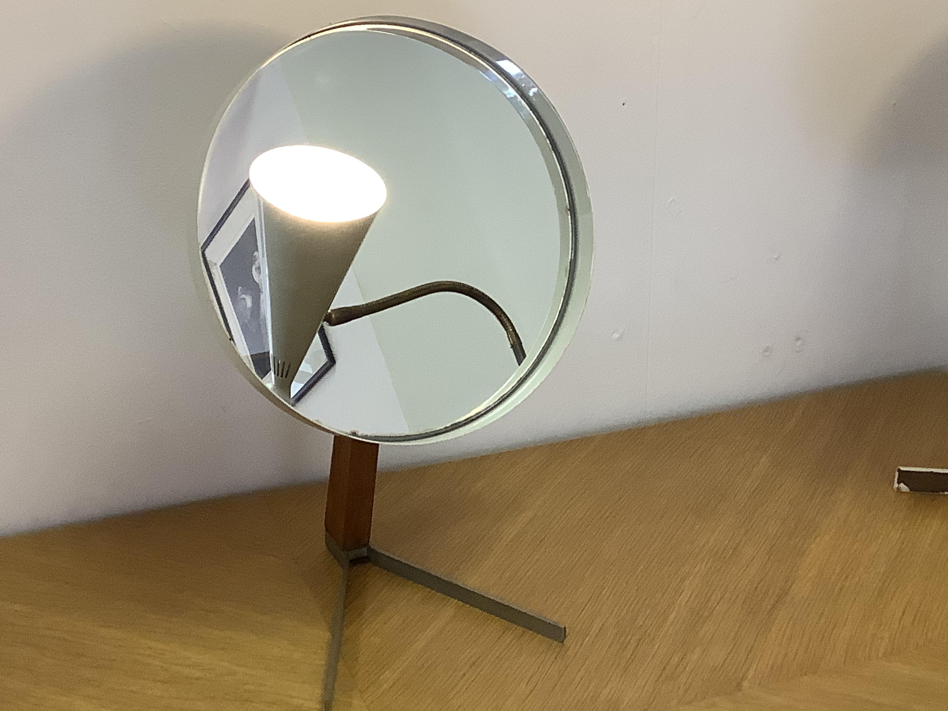 1960s classic Vanity mirror.
Teak wood with steel base with great patina.
White circular mirror frame with tilt action.
Attributed to both Robert Welch and Owen F Thomas.
Great practical and decorative piece.
Label intact on rear of