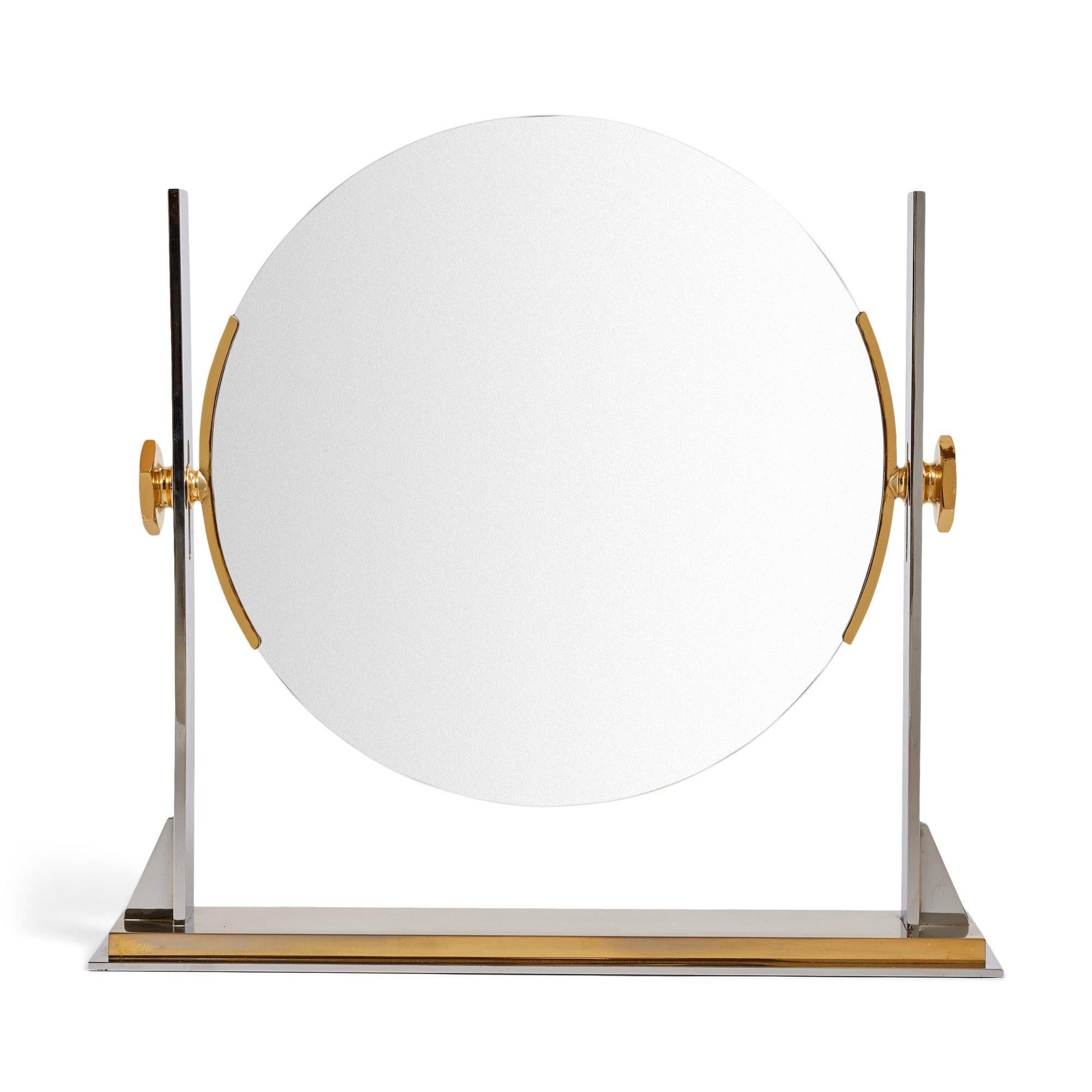A modernist vanity mirror in polished brass and chrome. Angle and height are adjustable.
