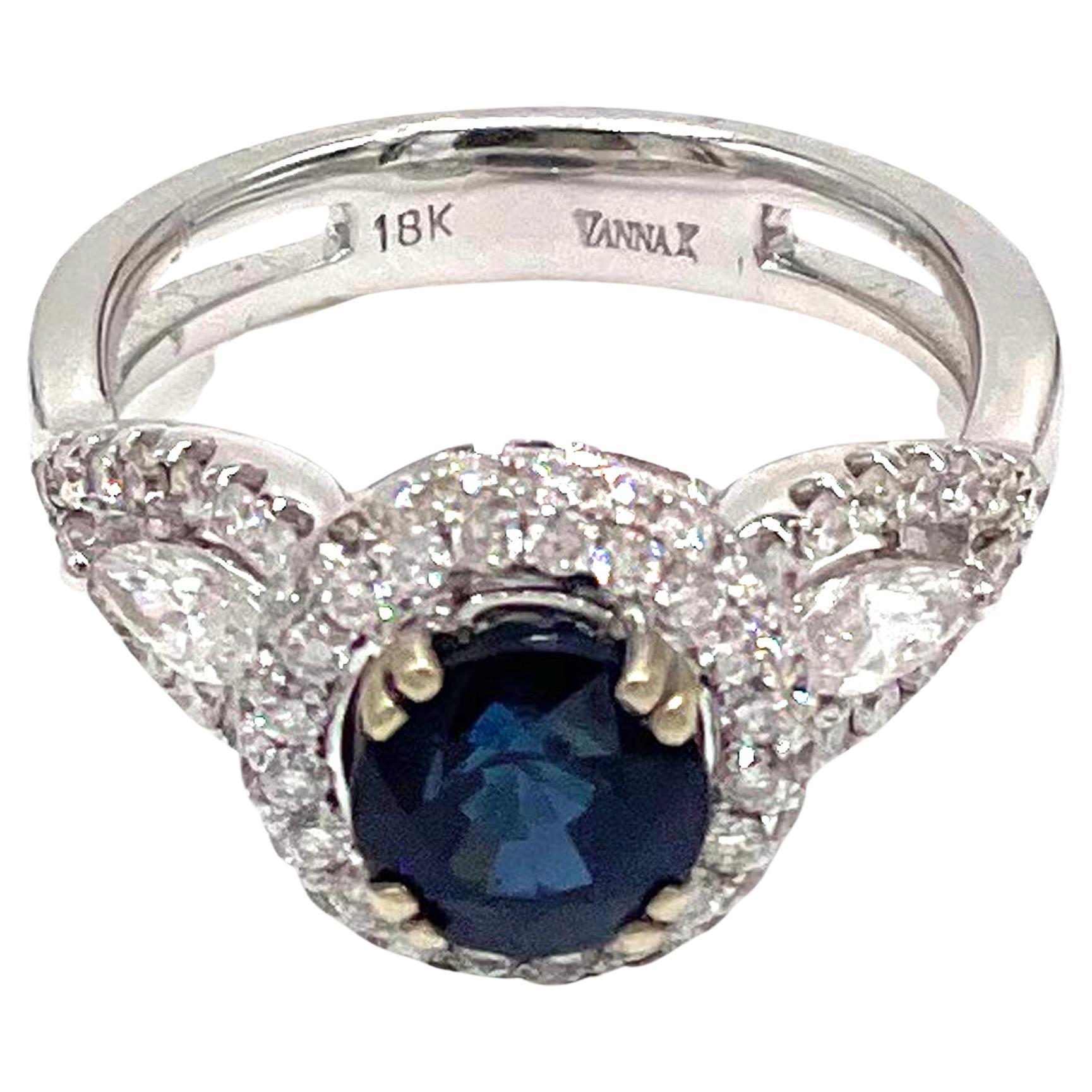 Vanna K 18K white gold three stone halo ring with two side marquis cut diamonds and round diamonds weighing a total of 1.12 carats. One center round blue sapphire 2.00 carats.

* Finger size 6.5
* Style No. 18RO6280DCZ
* Diamonds are G/H color,