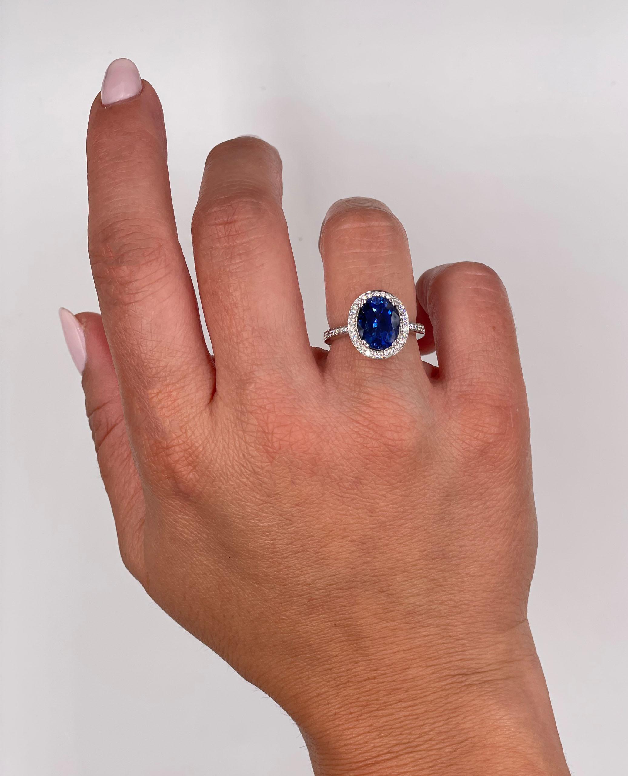 Women's 18K White Gold Halo Round Diamond Ring with Lab Grown Oval Sapphire 3.68 Carats For Sale