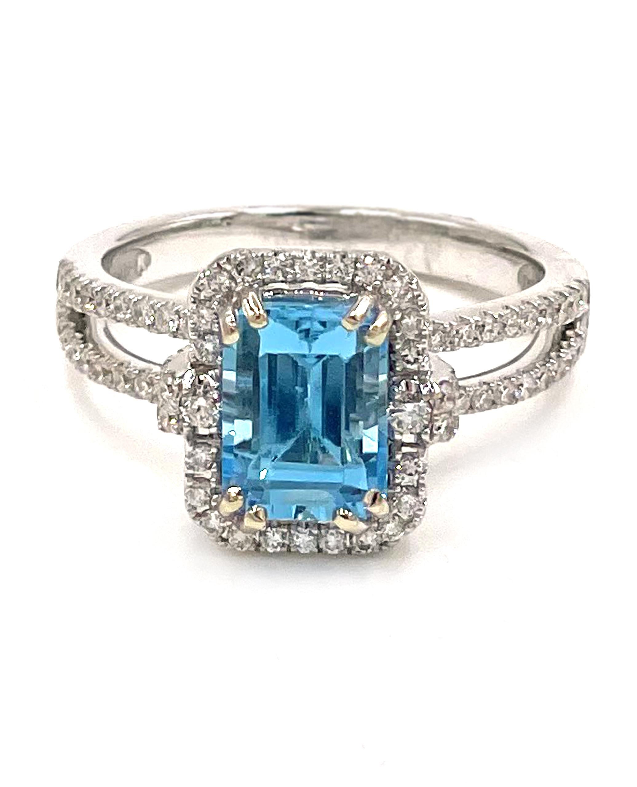 Vanna K 18RO51811DCZ 18K white gold halo ring with split shank and 84 round brilliant-cut diamonds totaling 0.55 carats. One center emerald cut Swiss blue topaz measuring 8x6mm.

* Finger size: 6.75
* Diamonds are G color, VS2/SI1 clarity.