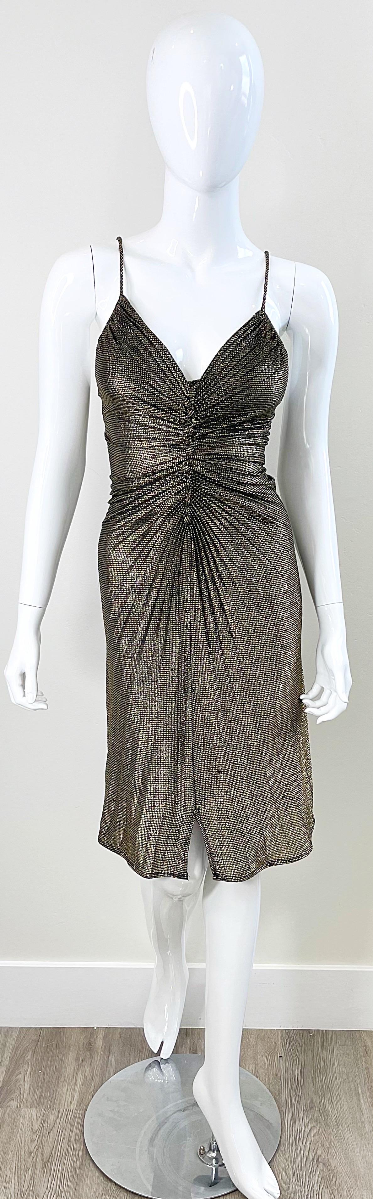 Sexy army 1980s SAMIR gold and black metallic lurex slinky disco Studio 54 dress. Vanna White wore the same dress, but in blue, on the cover of People Magazine ! Flattering pleated details throughout. Fabric covered mock buttons up the front. Hidden