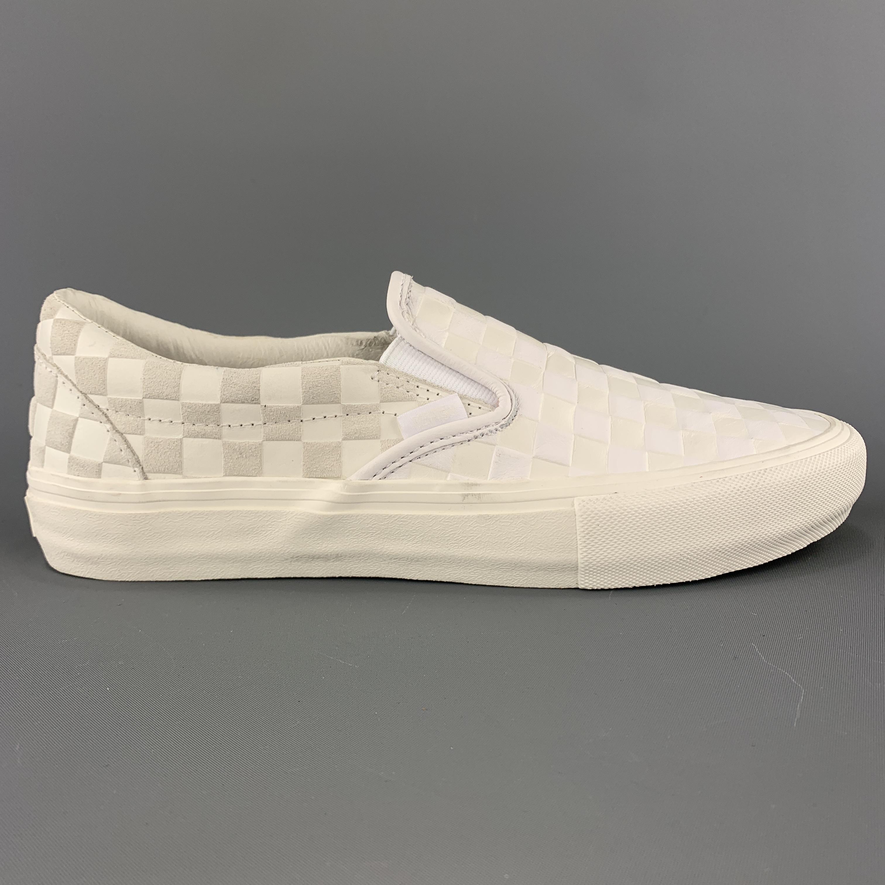 VANS x ENGINEERED GARMENTS Spring Summer 2019 slip on sneakers come in white checkered embossed leather with one sueded front panel, one sueded heel panel, and tonal rubber sole. With box. 

Excellent Pre-Owned Condition.. 
Marked: 9.5  
