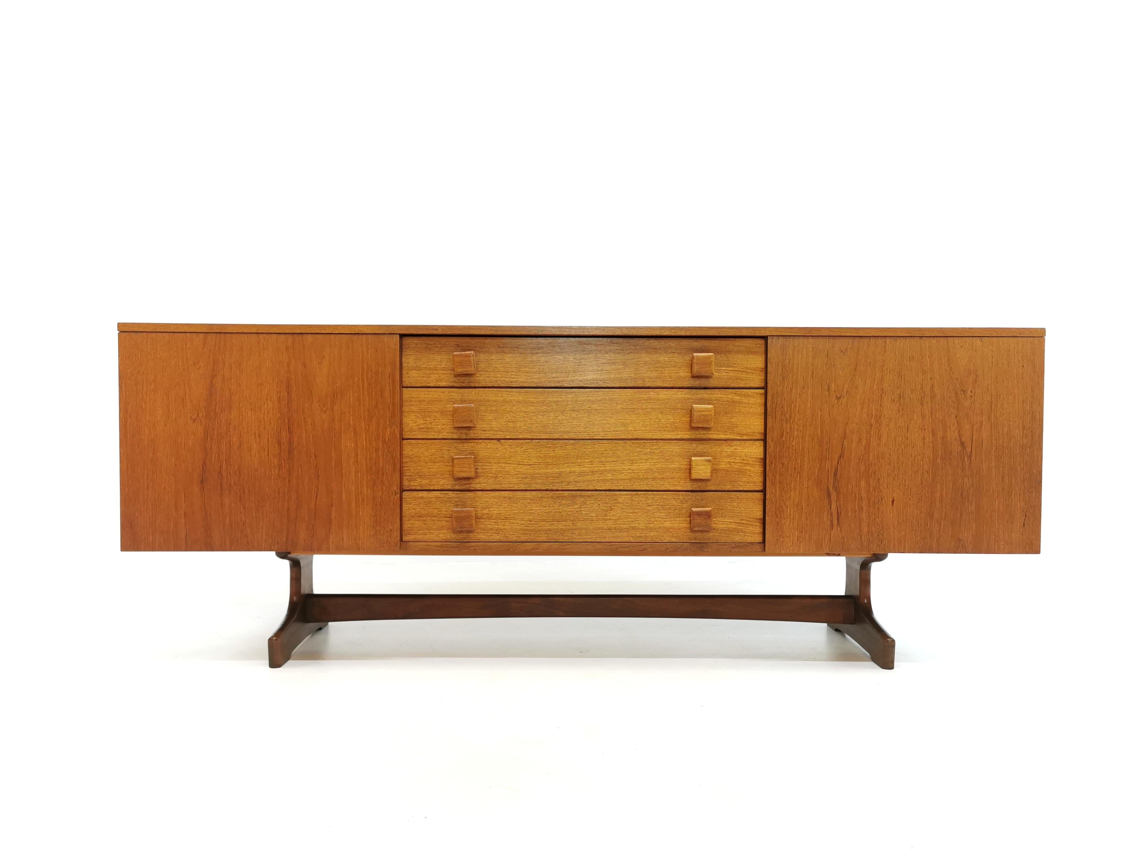 Superb sideboard/credenza designed by Peter Hayward for Vanson. 

Solid dark Afromosia legs. Curved ends. Superb quality and craftsmanship both inside and out. 

Features cupboard space and drawers.
 
