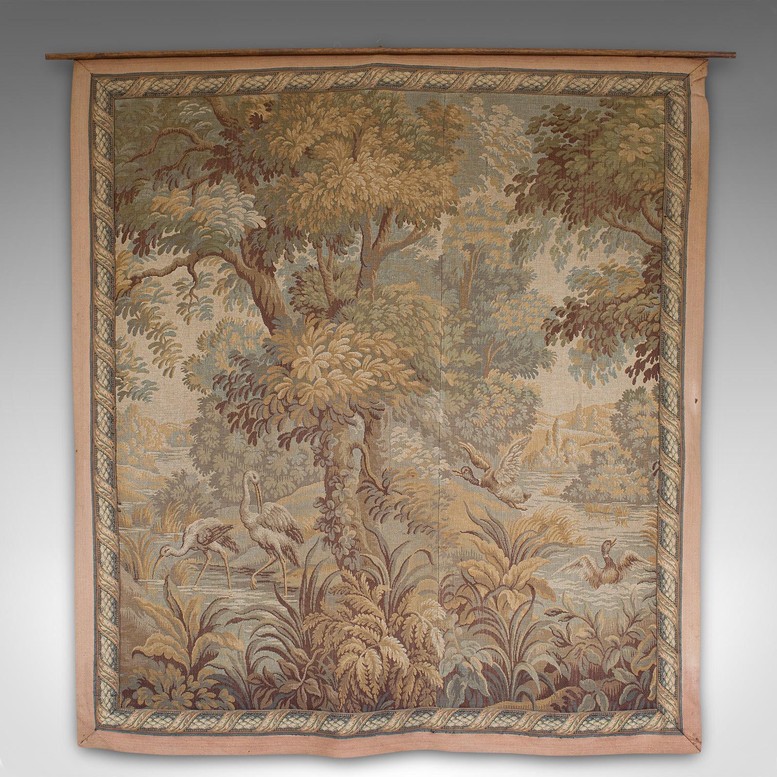 This is an antique verdure tapestry. A Continental, textile wall-hanging decorative piece, dating to the Victorian period, circa 1900.

Classical verdure forest scene
Displays a desirable aged patina
Woven textile in good order and displaying