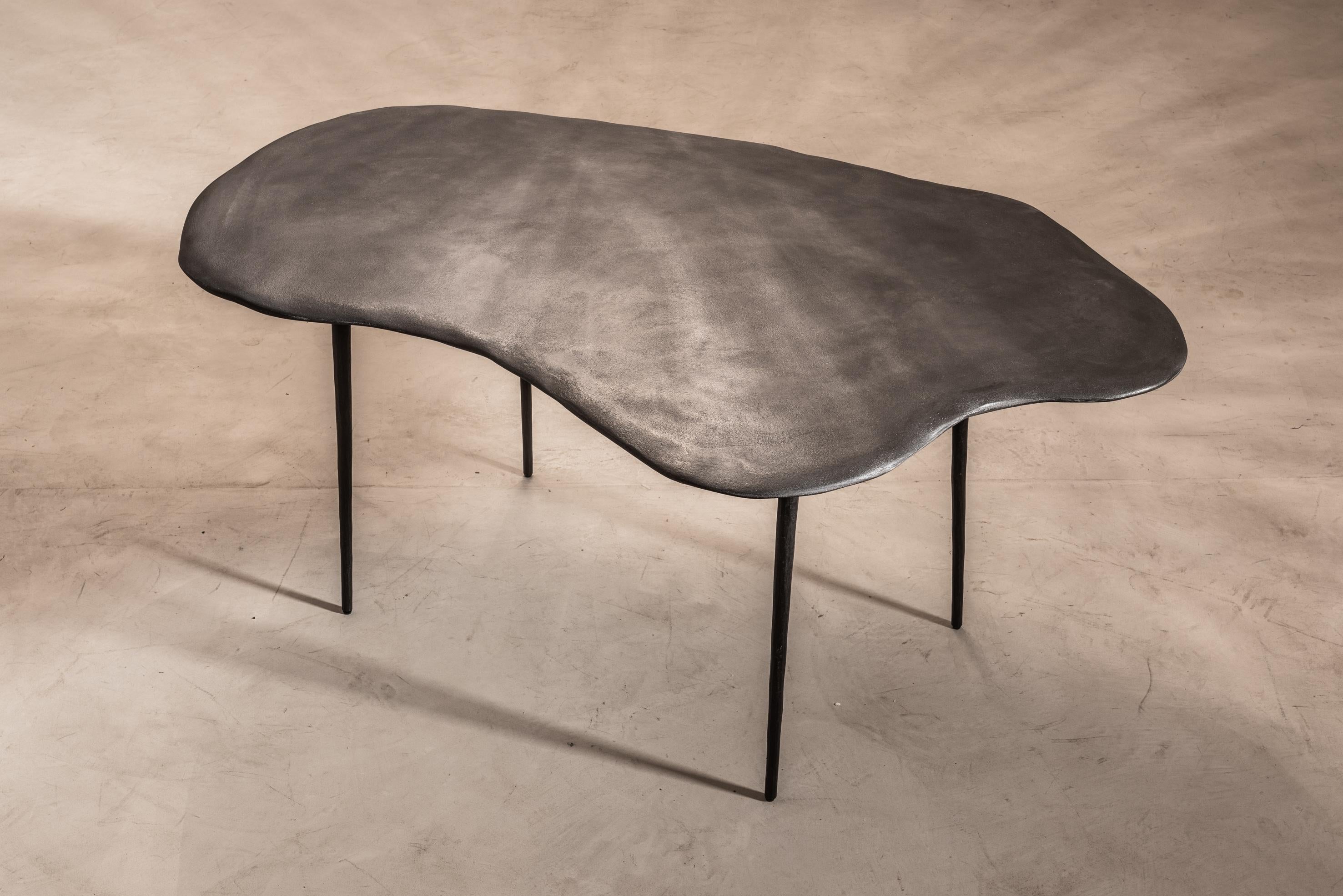 Varenna table A by Studio Emblématique
Dimensions: W 162 x D 95 x H 76 cm
Materials: Stone grain table top with conical metal hammered legs

Pushing the boundaries, going the extra mile to find the extraordinary piece that defines the space.