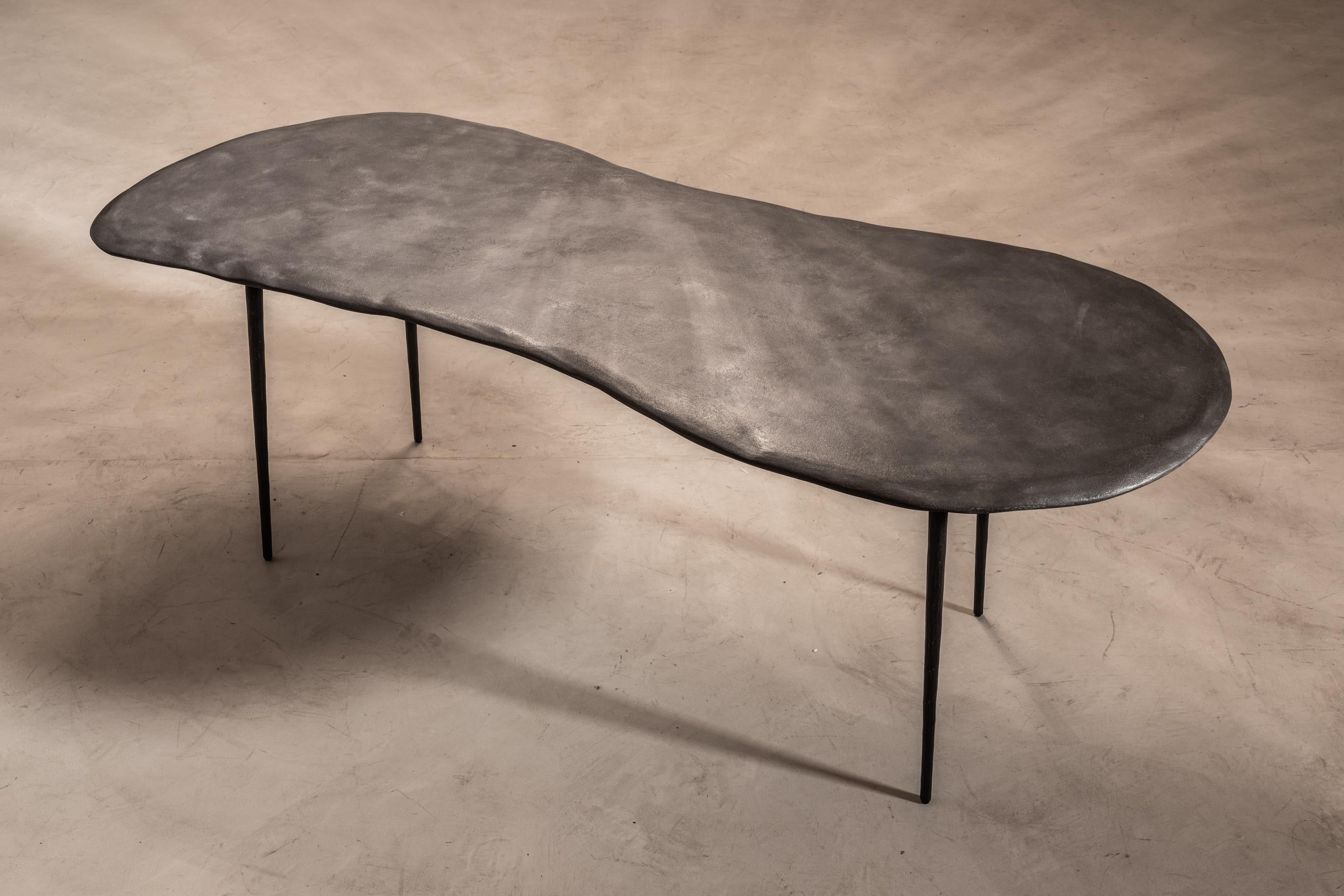 Varenna table B by Studio Emblématique
Dimensions: W 200 x D 85 x H 76 cm
Materials: Stonegrain table top with conical metal hammered legs

Pushing the boundaries, going the extra mile to find the extraordinary piece that defines the space.